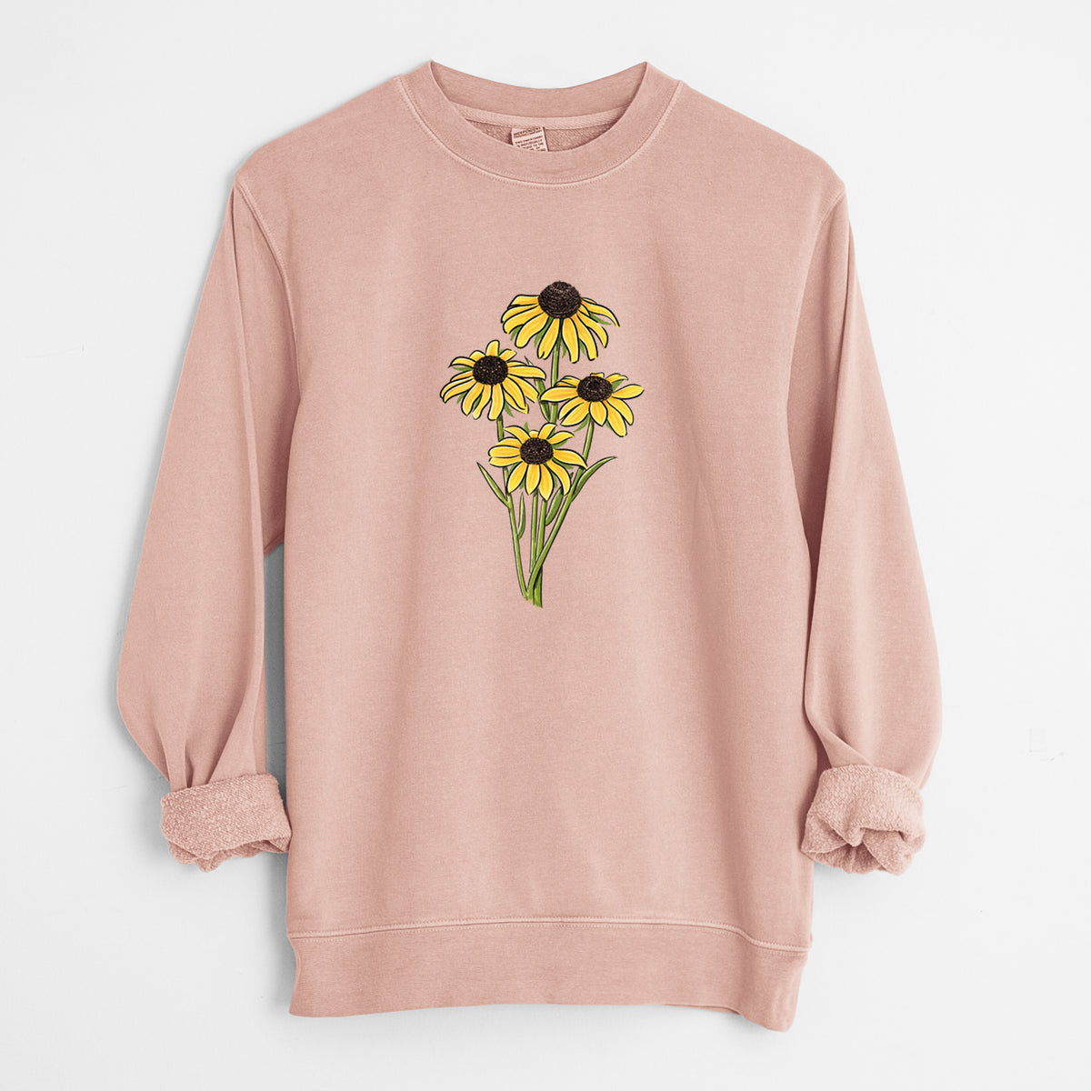 Dusty pink pigment dyed crewneck sweatshirt laid flat with the sleeves rolled, printed with a full-color bouquet of yellow black-eyed Susan flowers.