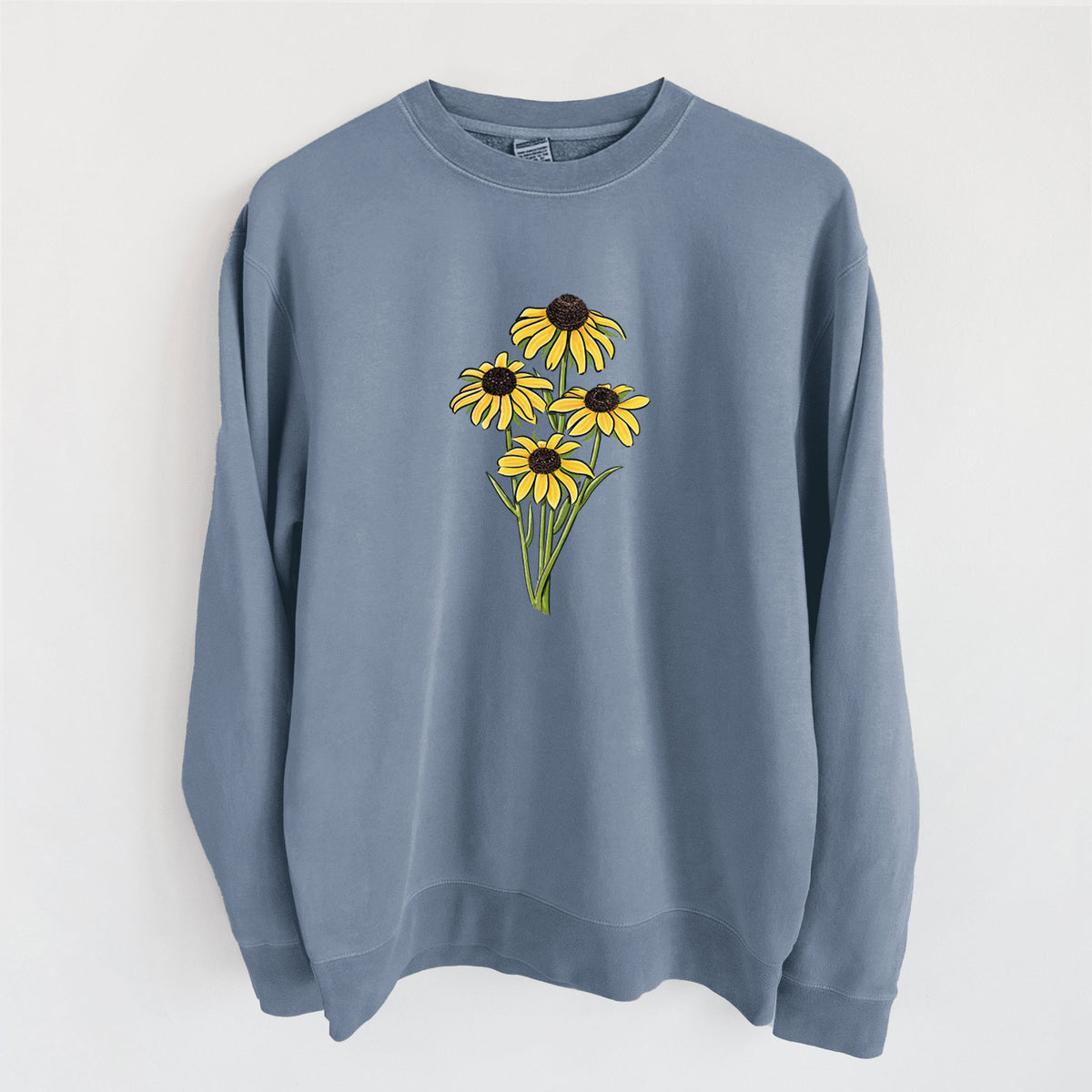 Slate blue pigment dyed crewneck sweatshirt laid flat, printed with a full-color bouquet of yellow black-eyed Susan flowers.