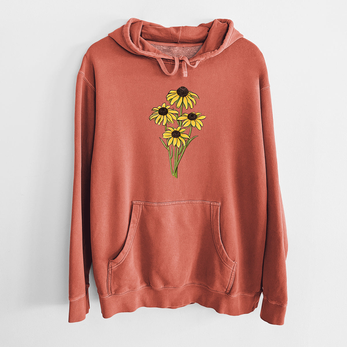 Amber orange pigment dyed hoodie laid flat, printed with a full-color bouquet of yellow black-eyed Susan flowers.