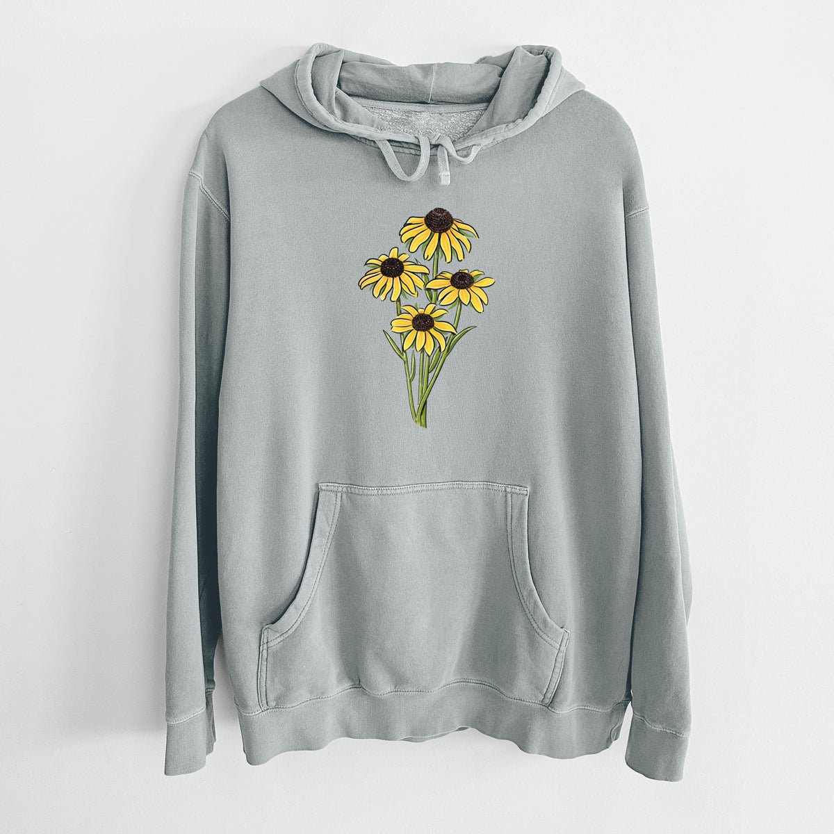Sage green pigment dyed hoodie laid flat, printed with a full-color bouquet of yellow black-eyed Susan flowers.