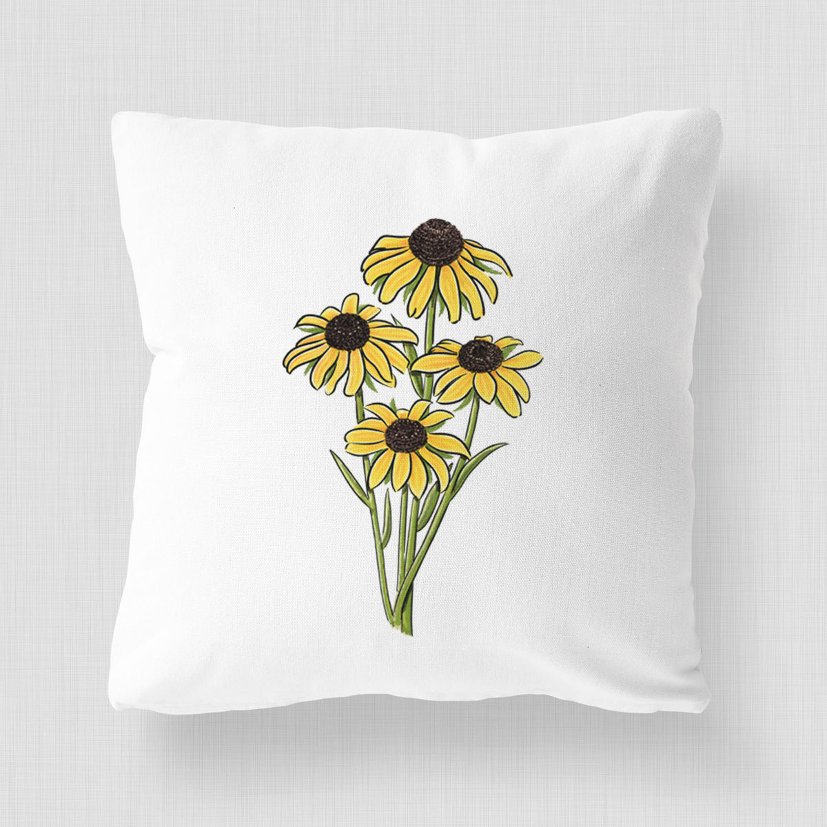 White pillow cover printed with a full-color bouquet of yellow black-eyed Susan flowers.