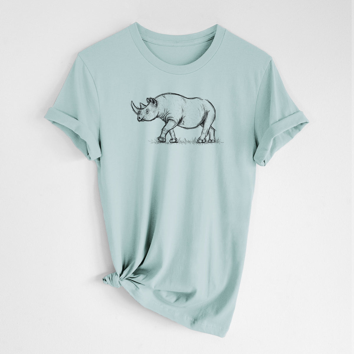 Dusty blue lightweight cotton t-shirt laid flat with the sleeves rolled, printed with a black ink illustration of a black rhinoceros walking.