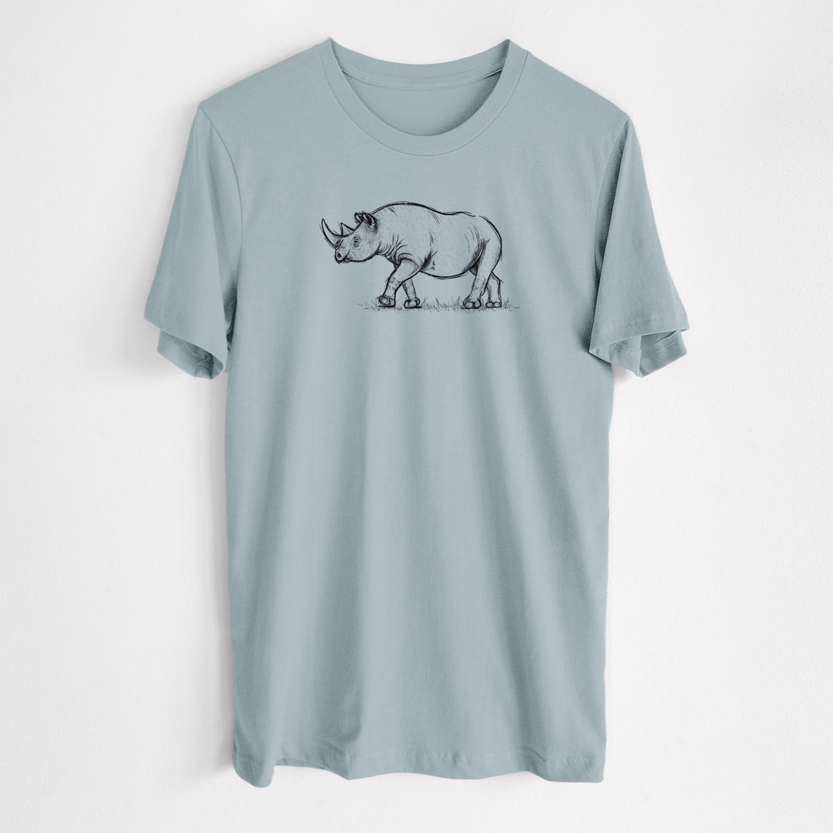 Vintage denim lightweight cotton t-shirt laid flat, printed with a black ink illustration of a black rhinoceros walking.