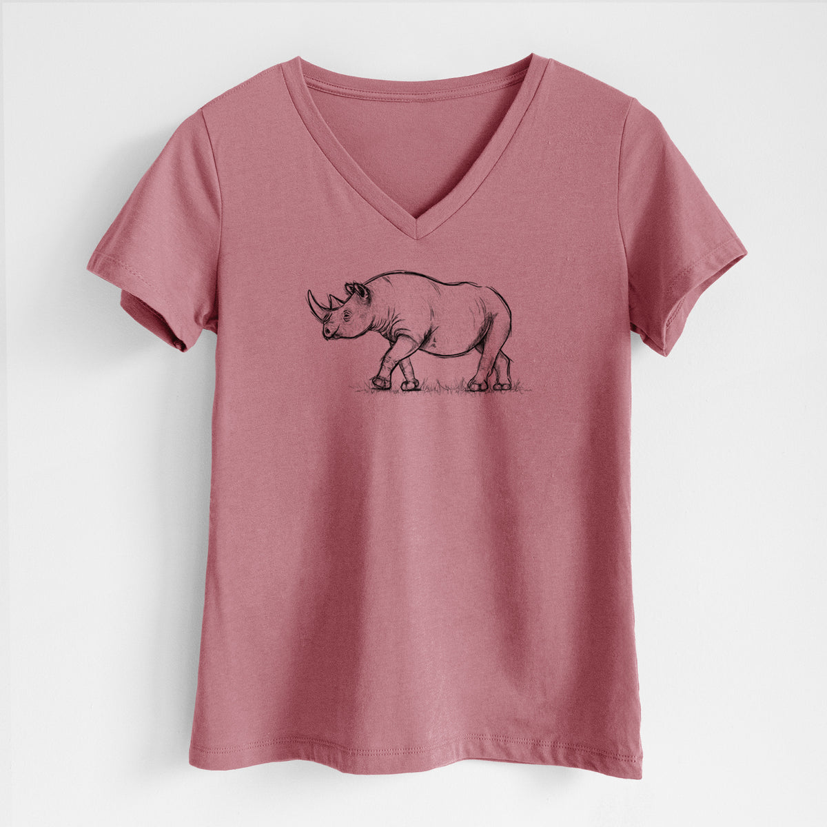 Mauve pink women's relaxed fit cotton V-neck t-shirt laid flat, printed with a black ink illustration of a black rhinoceros walking.