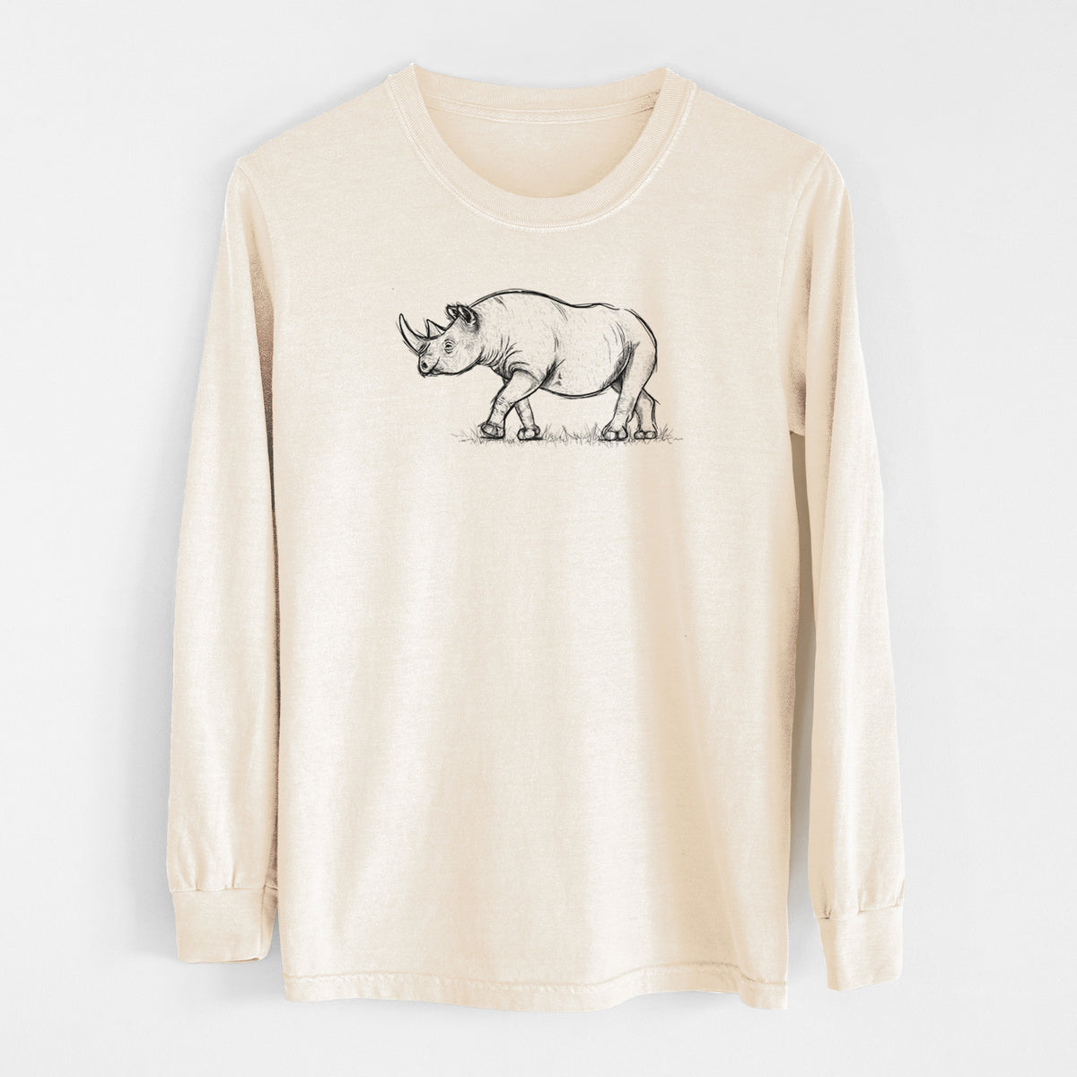 Ivory Comfort Colors long sleeve shirt laid flat, printed with a black ink illustration of a black rhinoceros walking.