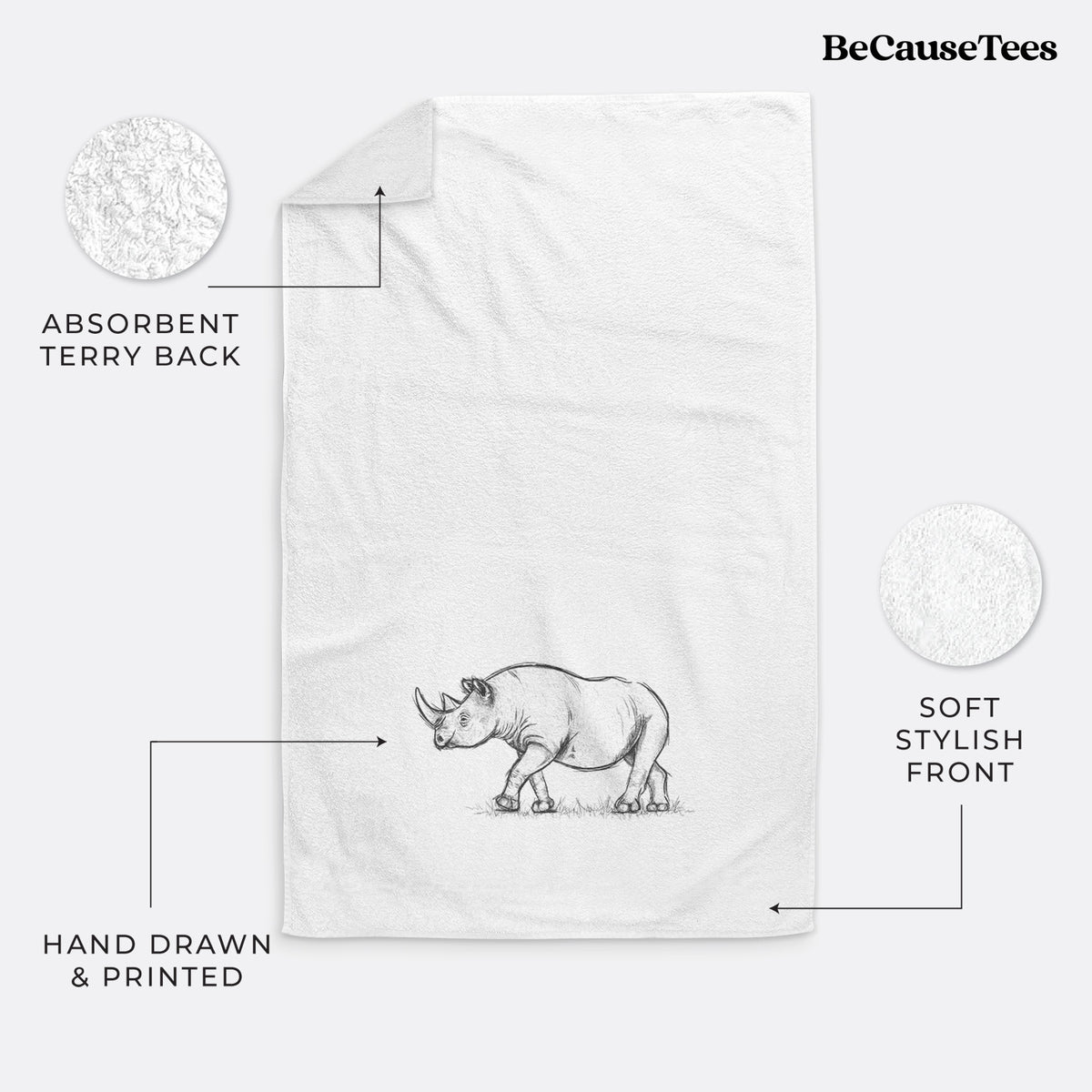 White hand towel printed with a black ink illustration of a black rhinoceros walking.