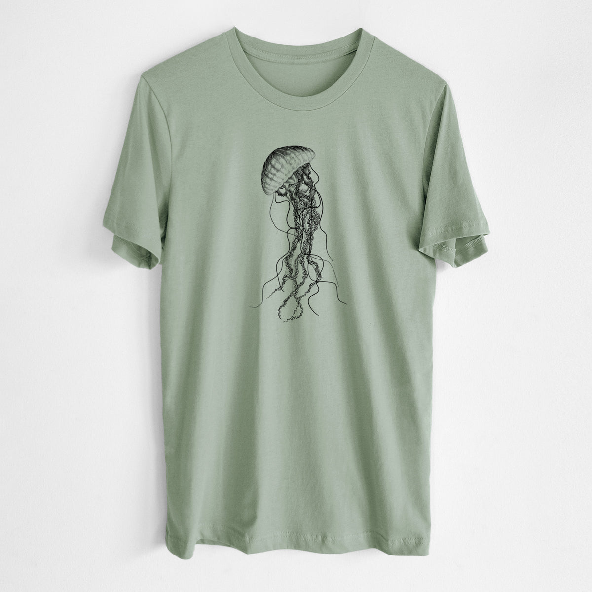 Sage green lightweight cotton t-shirt laid flat, printed with a black ink illustration of a black sea nettle jellyfish with long trailing tentacles.