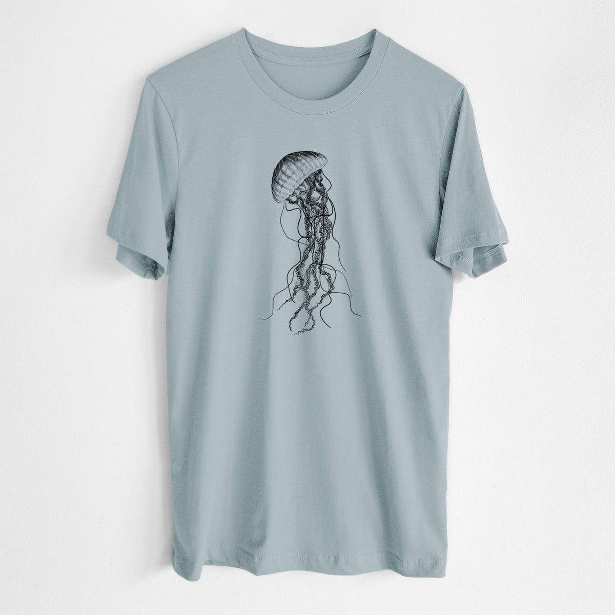 Vintage denim lightweight cotton t-shirt laid flat, printed with a black ink illustration of a black sea nettle jellyfish with long trailing tentacles.