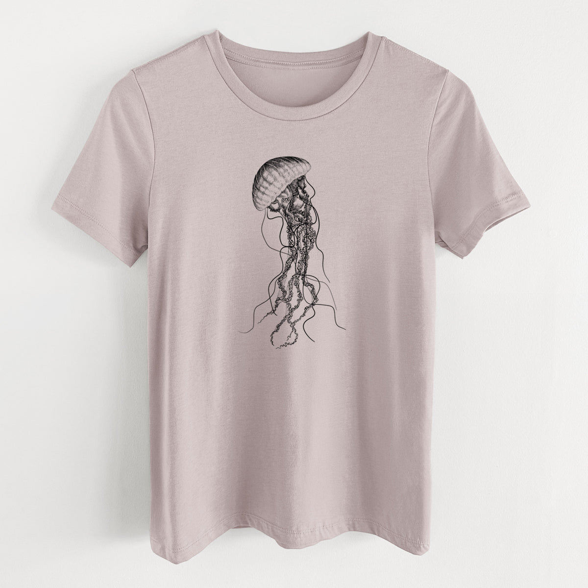 Pink gravel women's relaxed fit cotton t-shirt laid flat, printed with a black ink illustration of a black sea nettle jellyfish with long trailing tentacles.