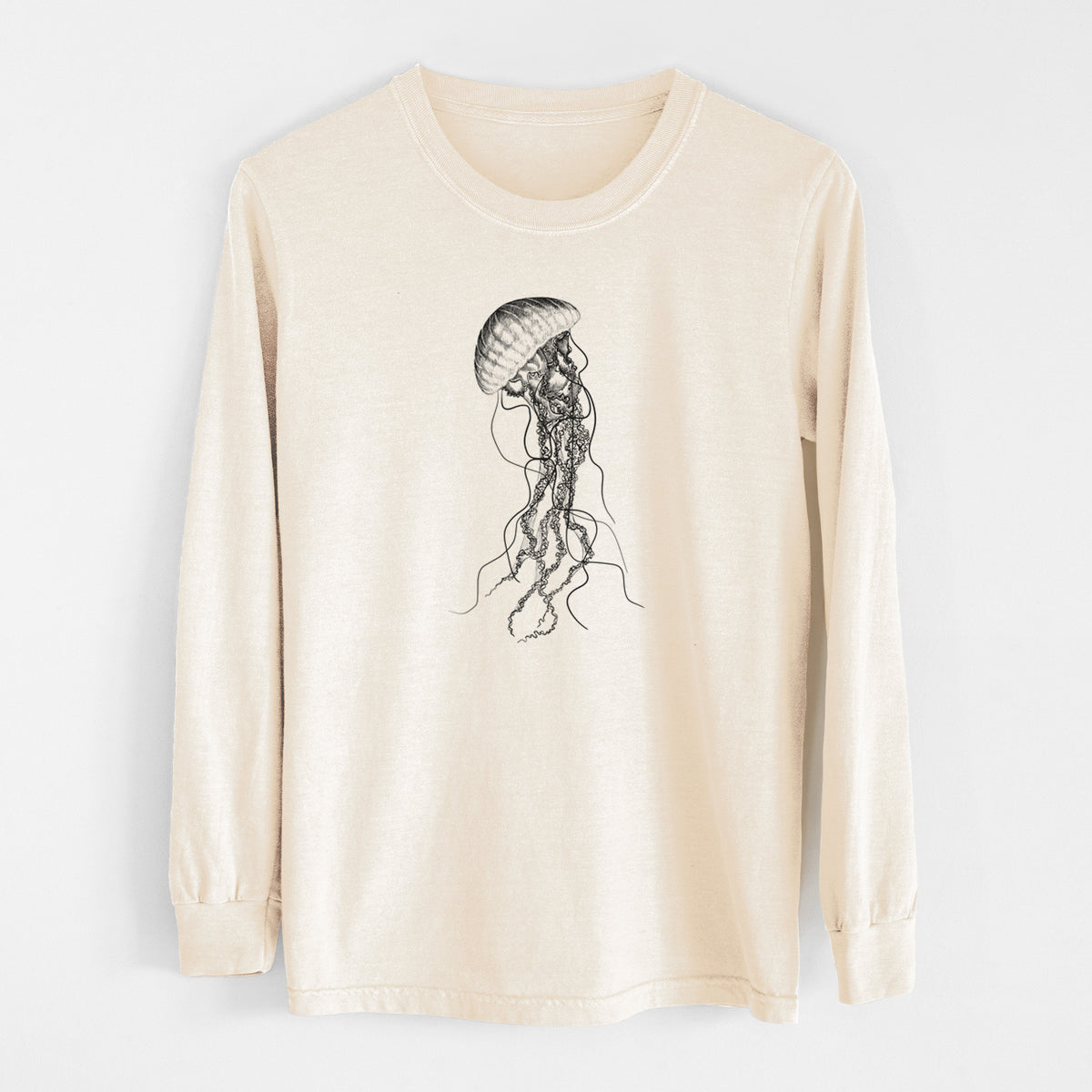 Ivory Comfort Colors long sleeve shirt laid flat, printed with a black ink illustration of a black sea nettle jellyfish with long trailing tentacles.