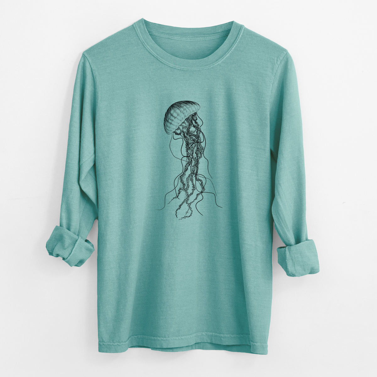 Reef green Comfort Colors long sleeve shirt laid flat with the cuffs rolled, printed with a black ink illustration of a black sea nettle jellyfish with long trailing tentacles.