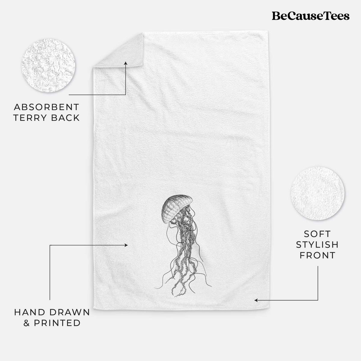 White hand towel printed with a black ink illustration of a black sea nettle jellyfish with long trailing tentacles.