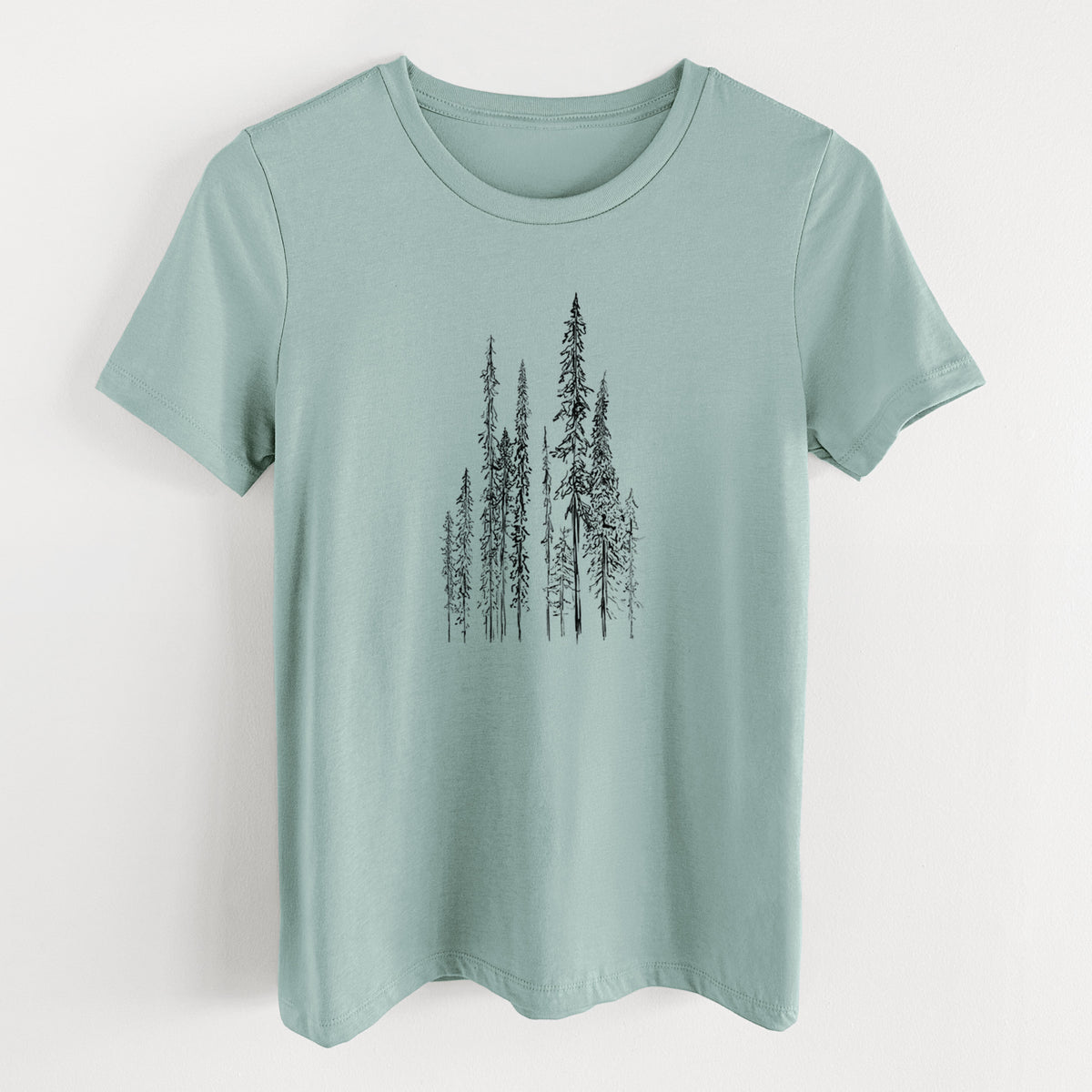 Dusty blue women's relaxed fit cotton t-shirt laid flat, printed with a black ink illustration of a stand of tall, narrow black spruce trees.