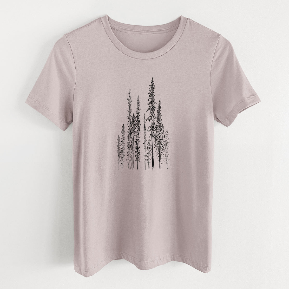 Pink gravel women's relaxed fit cotton t-shirt laid flat, printed with a black ink illustration of a stand of tall, narrow black spruce trees.