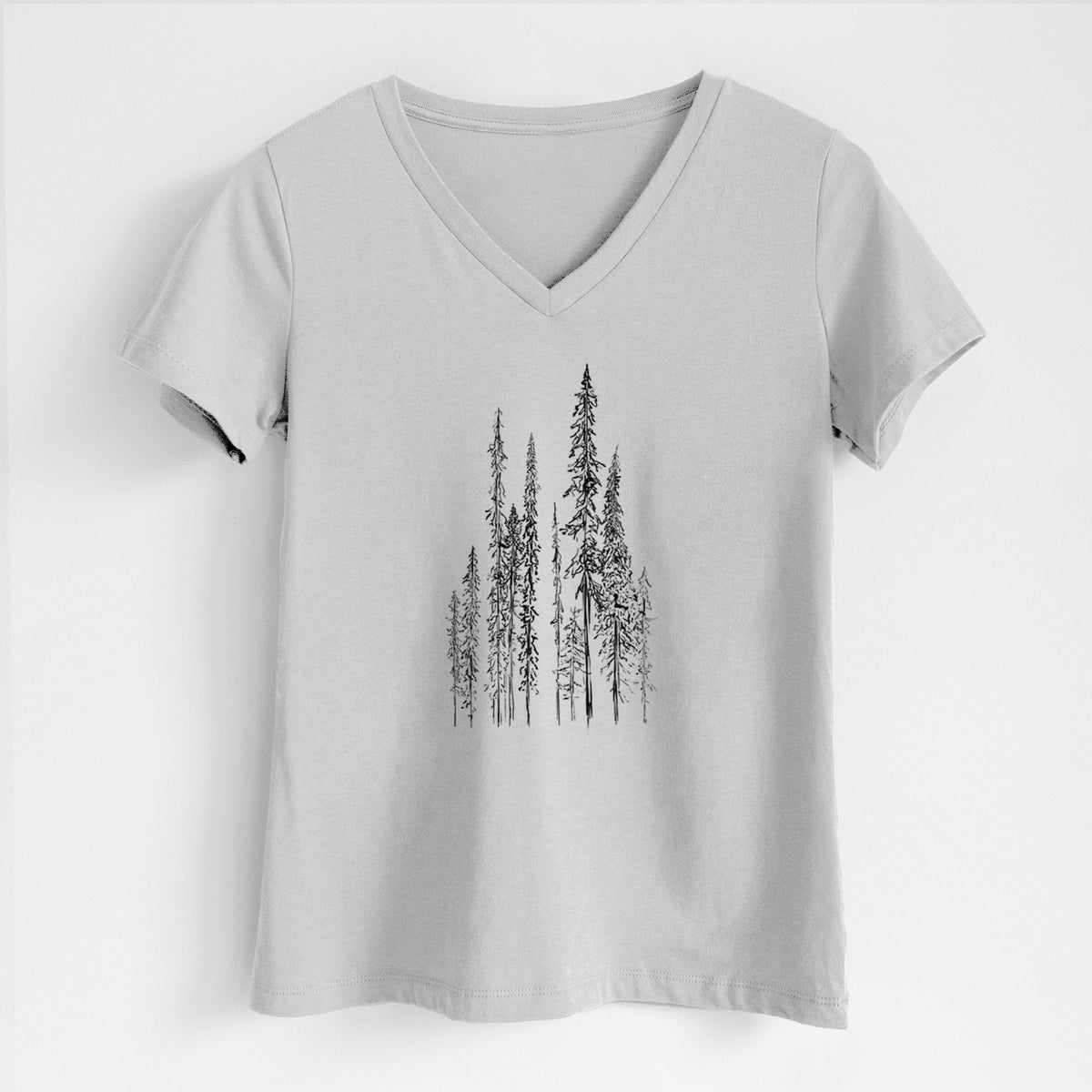 Lunar grey women's relaxed fit cotton V-neck t-shirt laid flat, printed with a black ink illustration of a stand of tall, narrow black spruce trees.