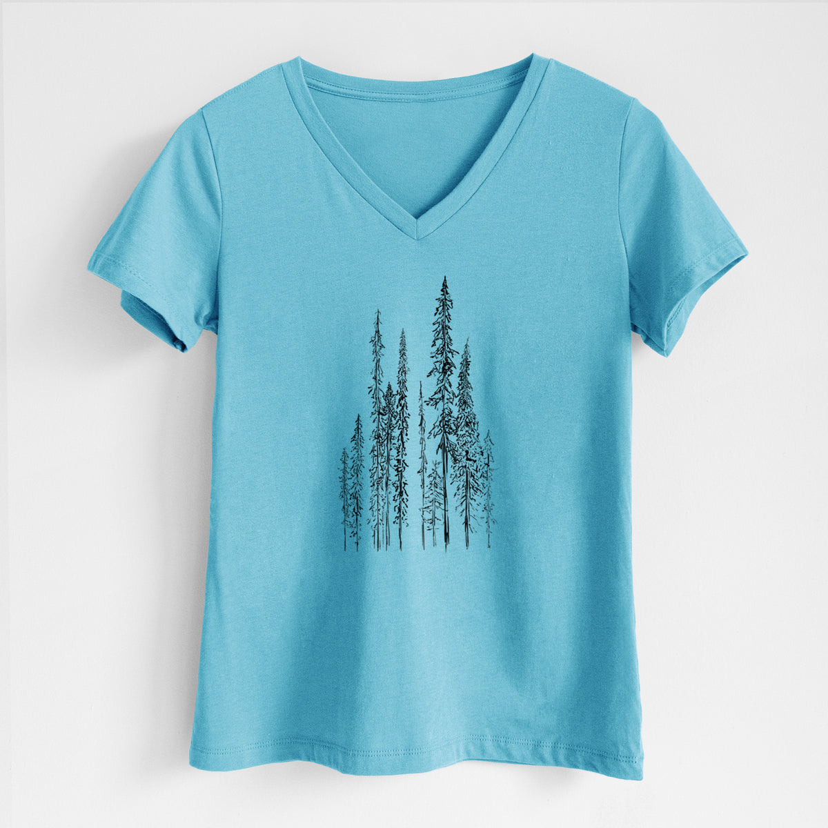 Turquoise women's relaxed fit cotton V-neck t-shirt laid flat, printed with a black ink illustration of a stand of tall, narrow black spruce trees.