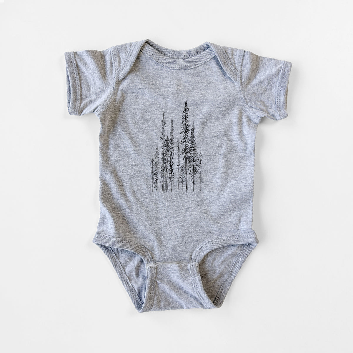 Grey baby bodysuit laid flat, printed with a black ink illustration of a stand of tall, narrow black spruce trees.