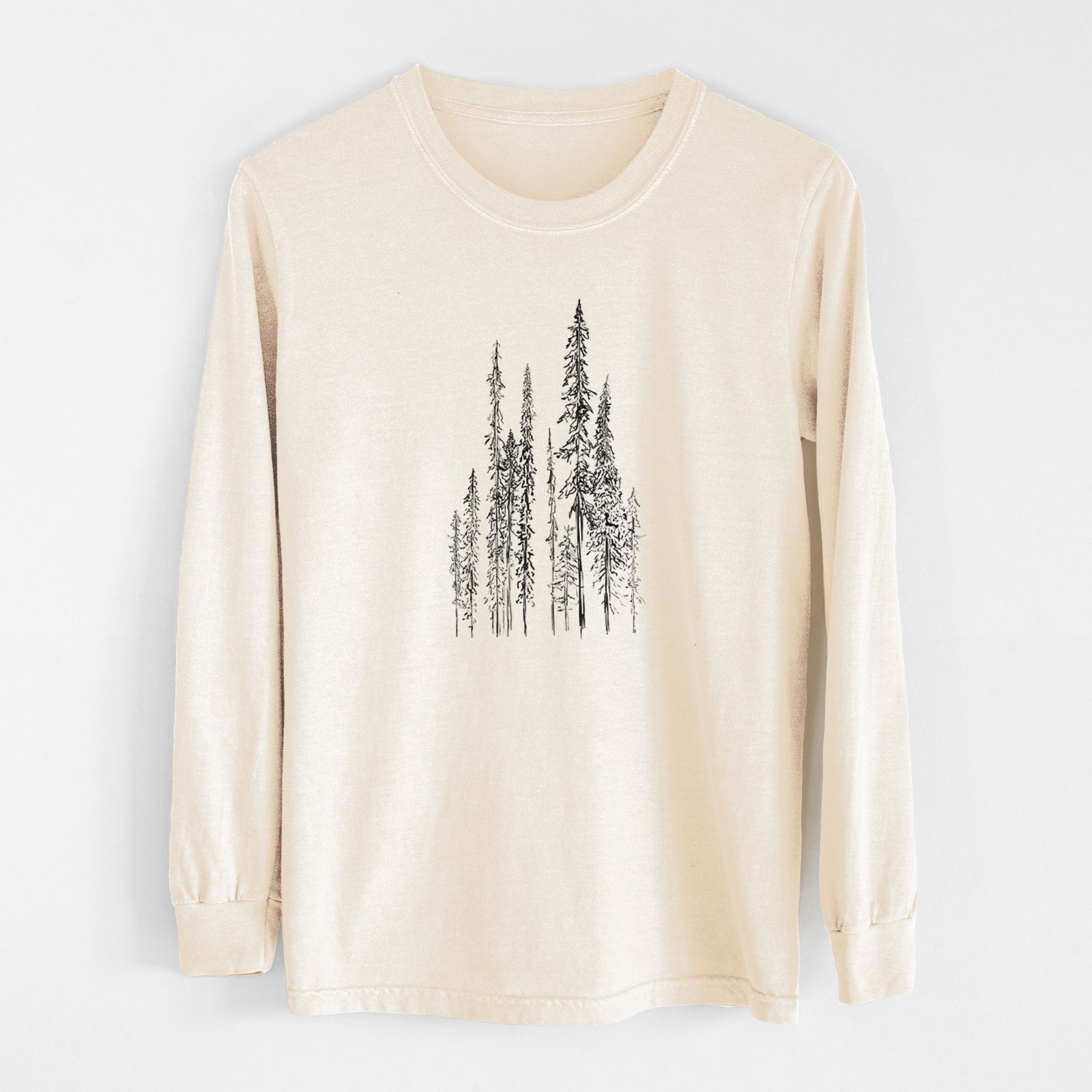 Ivory Comfort Colors long sleeve shirt laid flat, printed with a black ink illustration of a stand of tall, narrow black spruce trees.