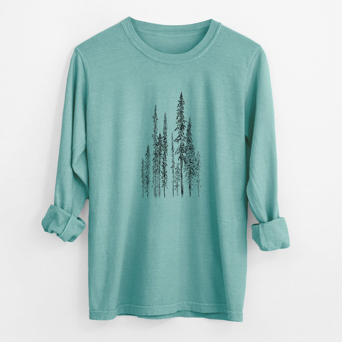 Reef green Comfort Colors long sleeve shirt laid flat with the cuffs rolled, printed with a black ink illustration of a stand of tall, narrow black spruce trees.