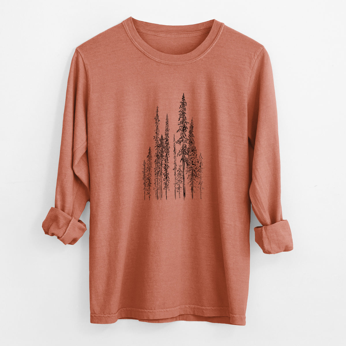 Yam burnt orange Comfort Colors long sleeve shirt laid flat with the cuffs rolled, printed with a black ink illustration of a stand of tall, narrow black spruce trees.