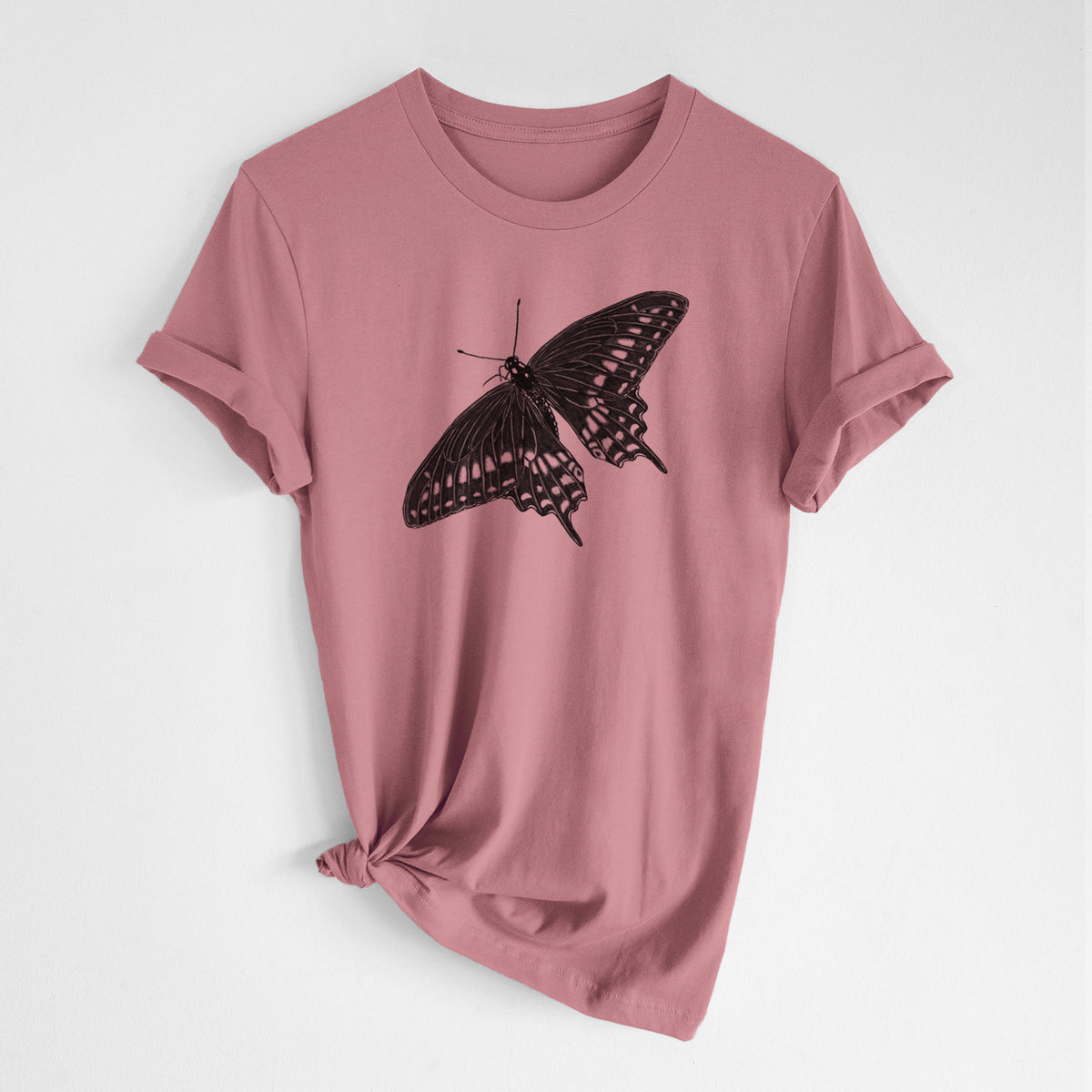Mauve pink lightweight cotton t-shirt laid flat with the sleeves rolled, printed with a detailed black ink illustration of a black swallowtail butterfly with its wings spread.