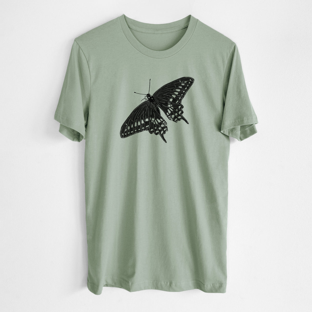 Sage green lightweight cotton t-shirt laid flat, printed with a detailed black ink illustration of a black swallowtail butterfly with its wings spread.