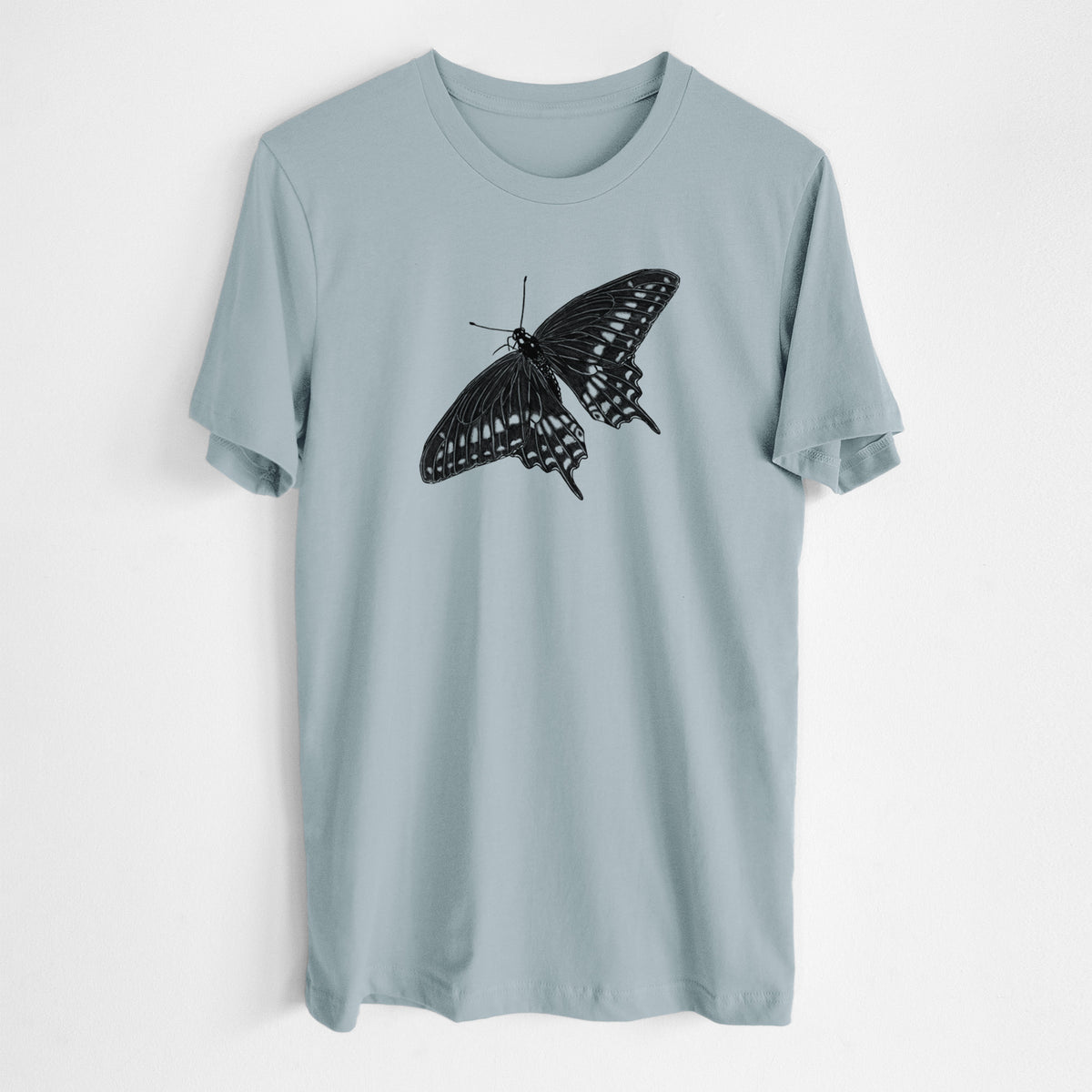 Vintage denim lightweight cotton t-shirt laid flat, printed with a detailed black ink illustration of a black swallowtail butterfly with its wings spread.
