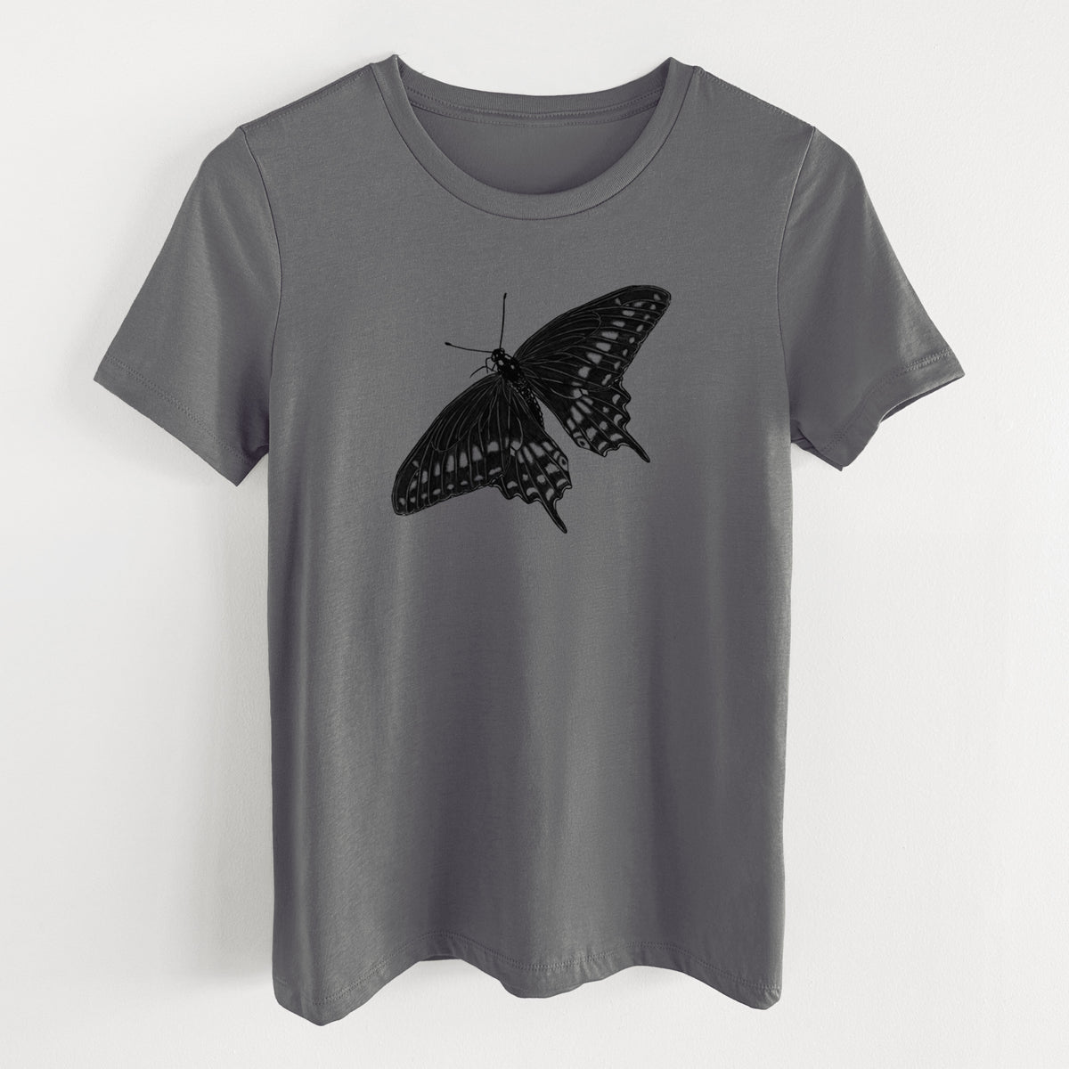 Asphalt women's relaxed fit cotton t-shirt laid flat, printed with a detailed black ink illustration of a black swallowtail butterfly with its wings spread.