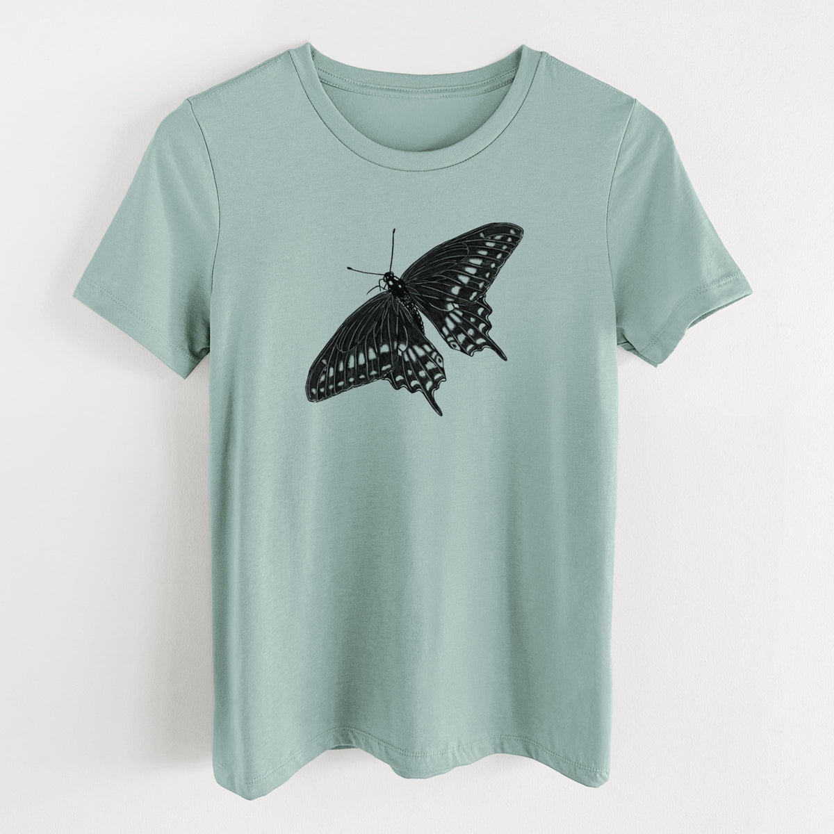 Dusty blue women's relaxed fit cotton t-shirt laid flat, printed with a detailed black ink illustration of a black swallowtail butterfly with its wings spread.