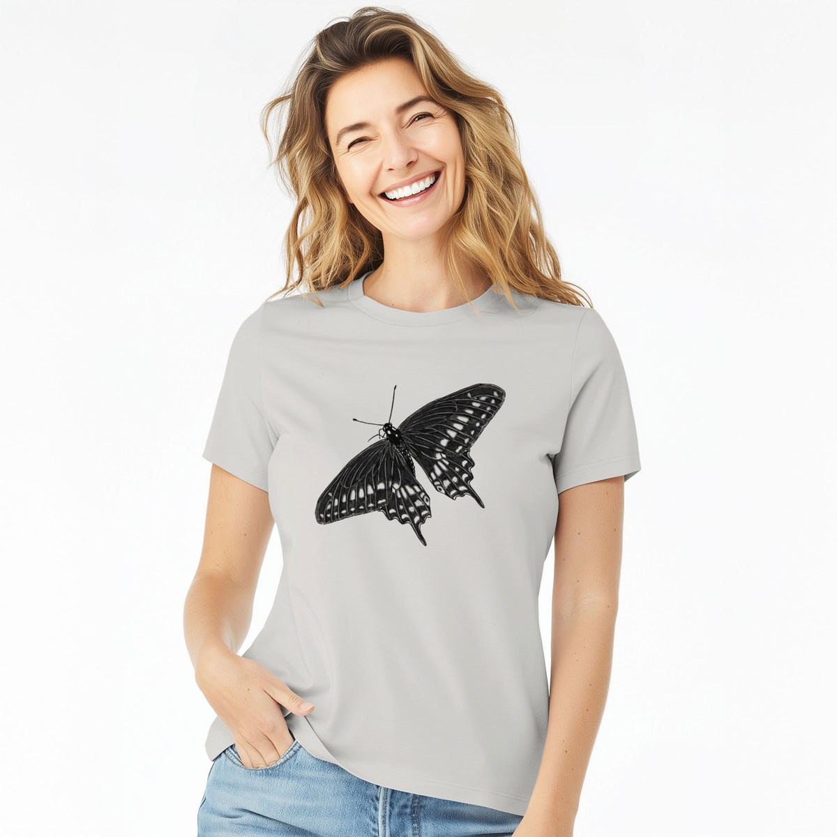 Woman wearing a lunar grey women's relaxed fit cotton t-shirt printed with a detailed black ink illustration of a black swallowtail butterfly with its wings spread.