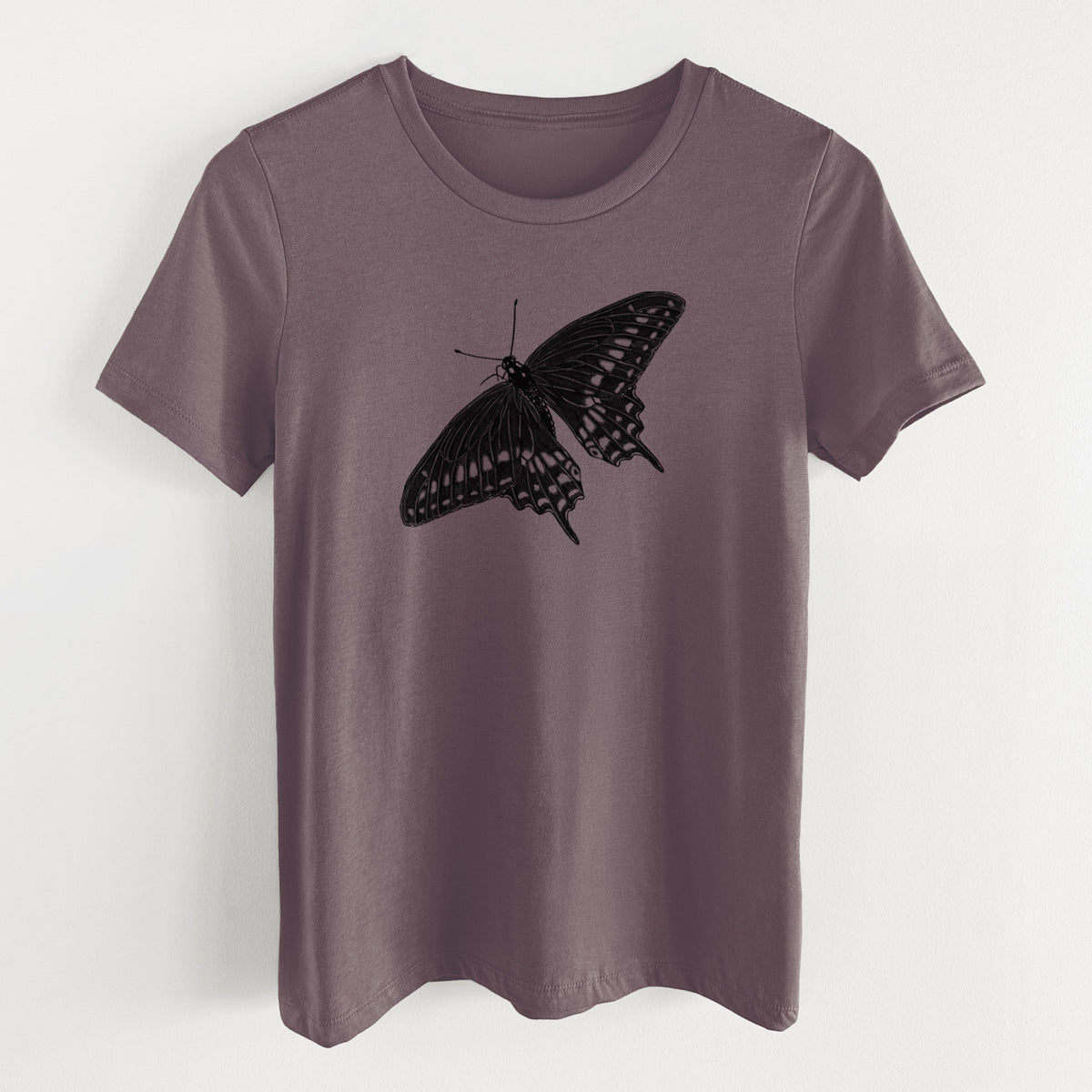Purple storm women's relaxed fit cotton t-shirt laid flat, printed with a detailed black ink illustration of a black swallowtail butterfly with its wings spread.
