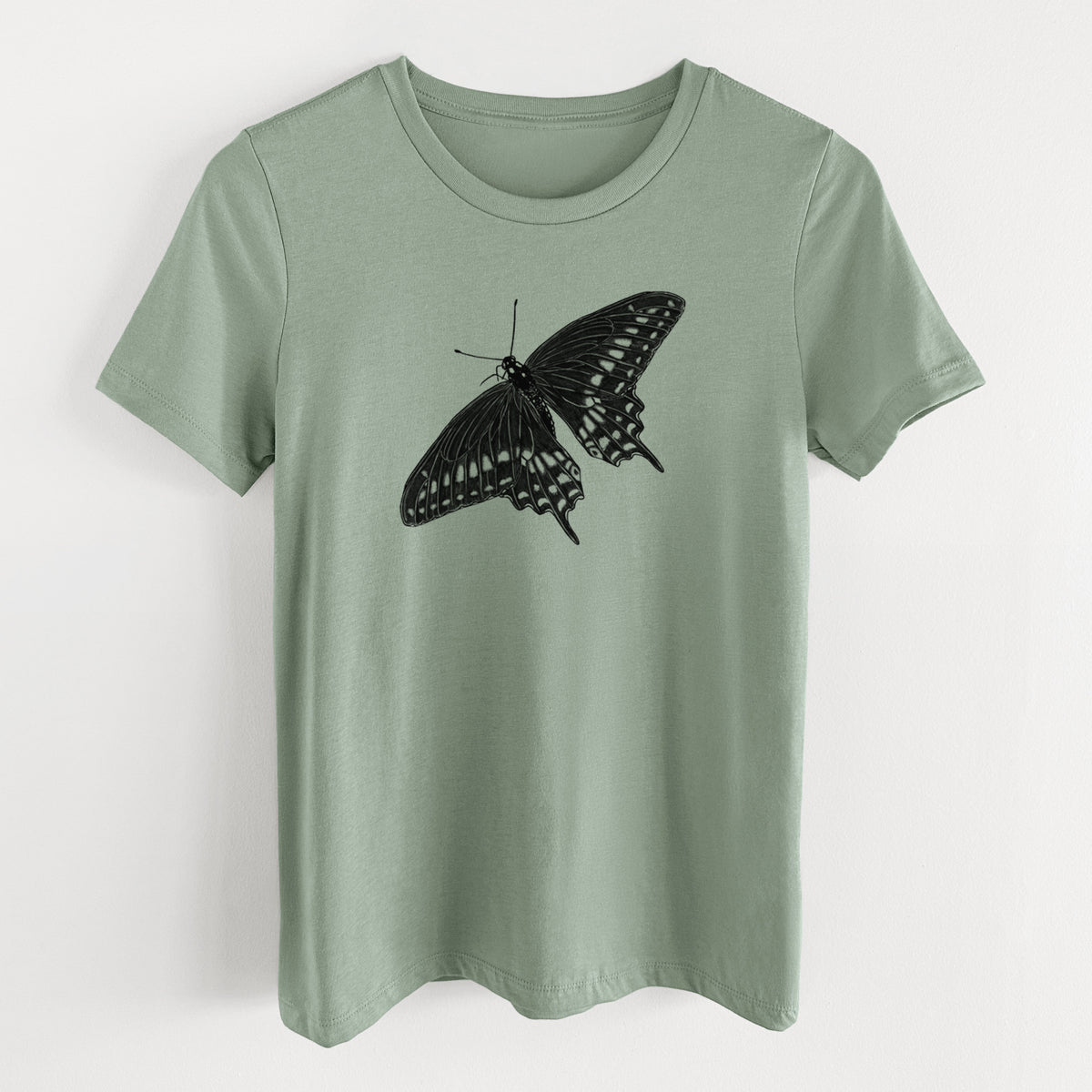 Sage green women's relaxed fit cotton t-shirt laid flat, printed with a detailed black ink illustration of a black swallowtail butterfly with its wings spread.
