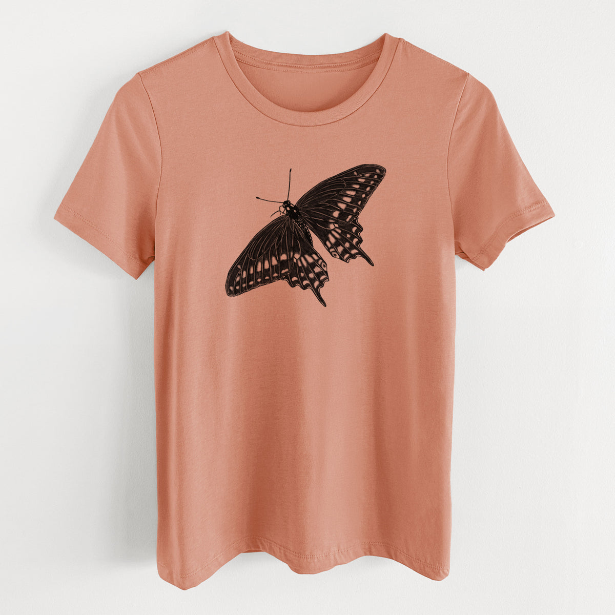 Terracotta orange women's relaxed fit cotton t-shirt laid flat, printed with a detailed black ink illustration of a black swallowtail butterfly with its wings spread.