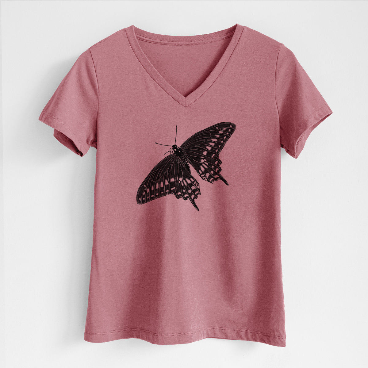 Mauve pink women's relaxed fit cotton V-neck t-shirt laid flat, printed with a detailed black ink illustration of a black swallowtail butterfly with its wings spread.