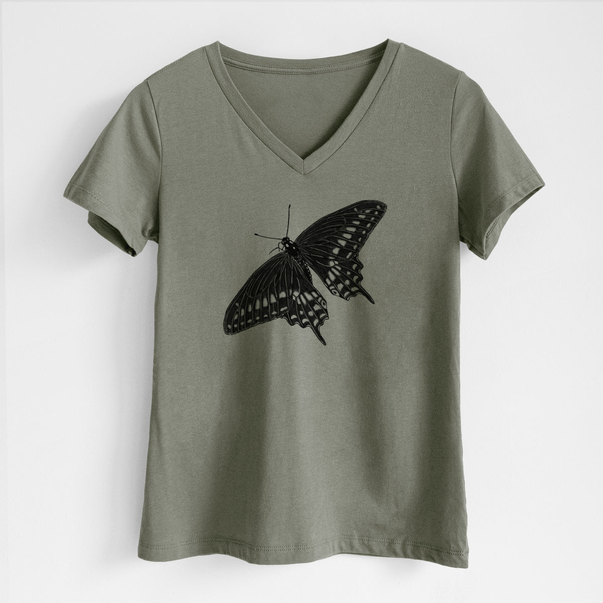 Military green women's relaxed fit cotton V-neck t-shirt laid flat, printed with a detailed black ink illustration of a black swallowtail butterfly with its wings spread.