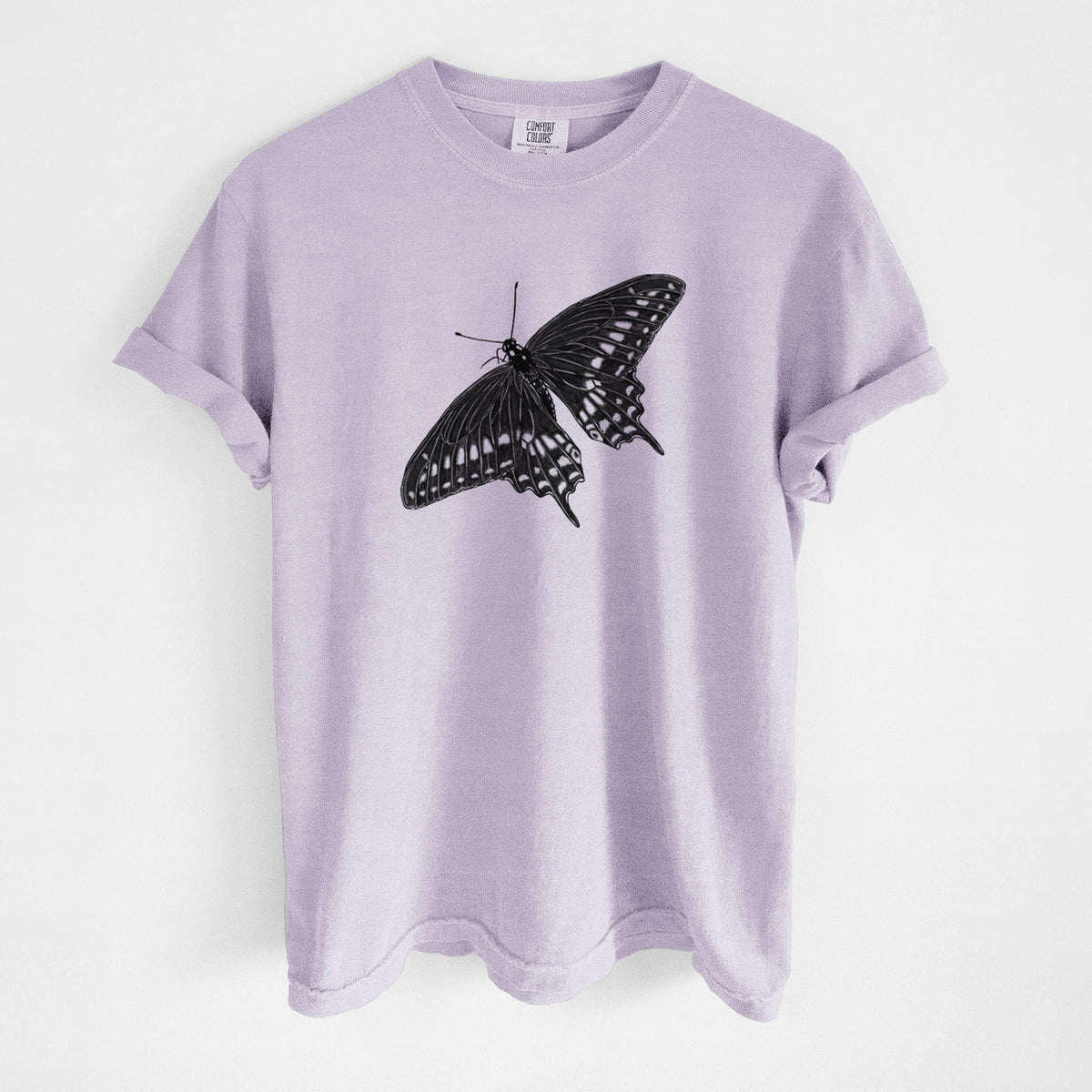 Orchid purple Comfort Colors t-shirt laid flat, printed with a detailed black ink illustration of a black swallowtail butterfly with its wings spread.