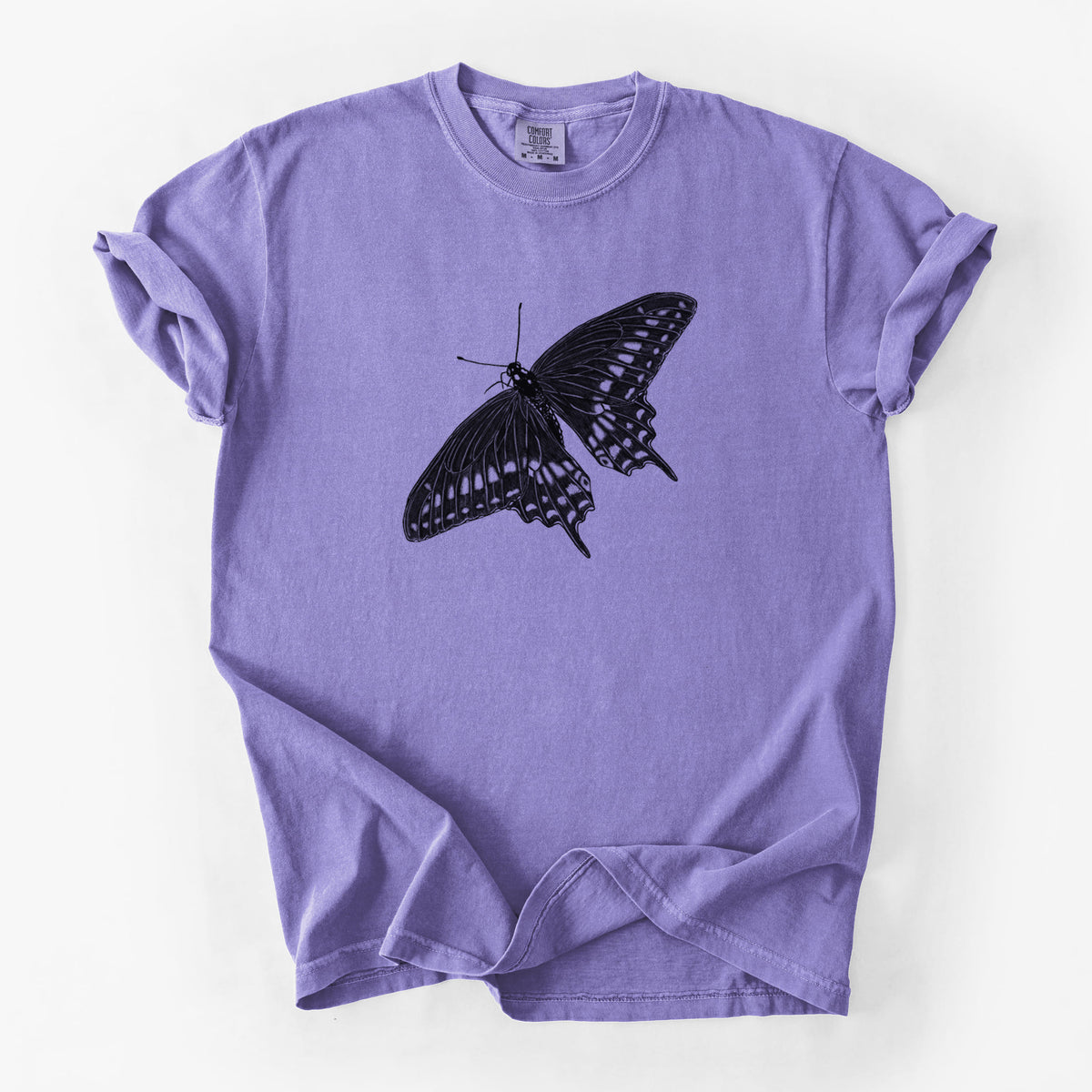 Violet purple Comfort Colors t-shirt laid flat, printed with a detailed black ink illustration of a black swallowtail butterfly with its wings spread.