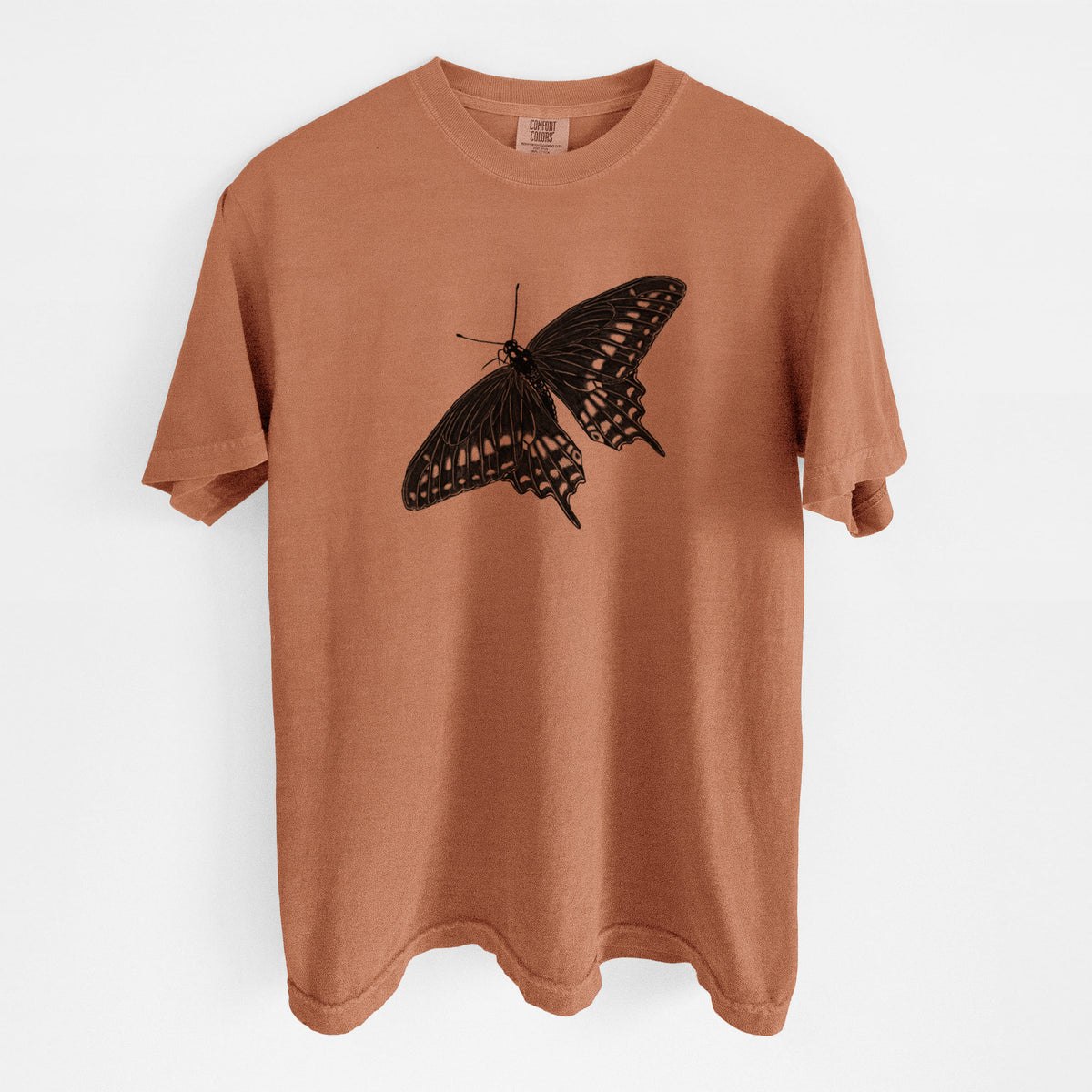 Yam burnt orange Comfort Colors t-shirt laid flat, printed with a detailed black ink illustration of a black swallowtail butterfly with its wings spread.