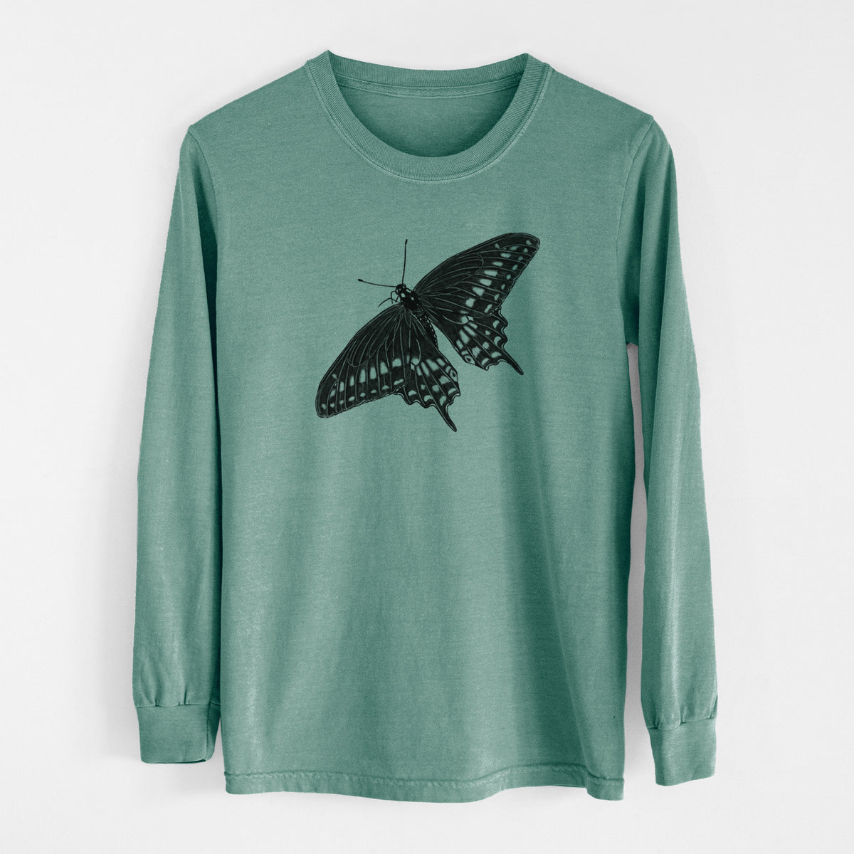 Pine green Comfort Colors long sleeve shirt laid flat, printed with a detailed black ink illustration of a black swallowtail butterfly with its wings spread.