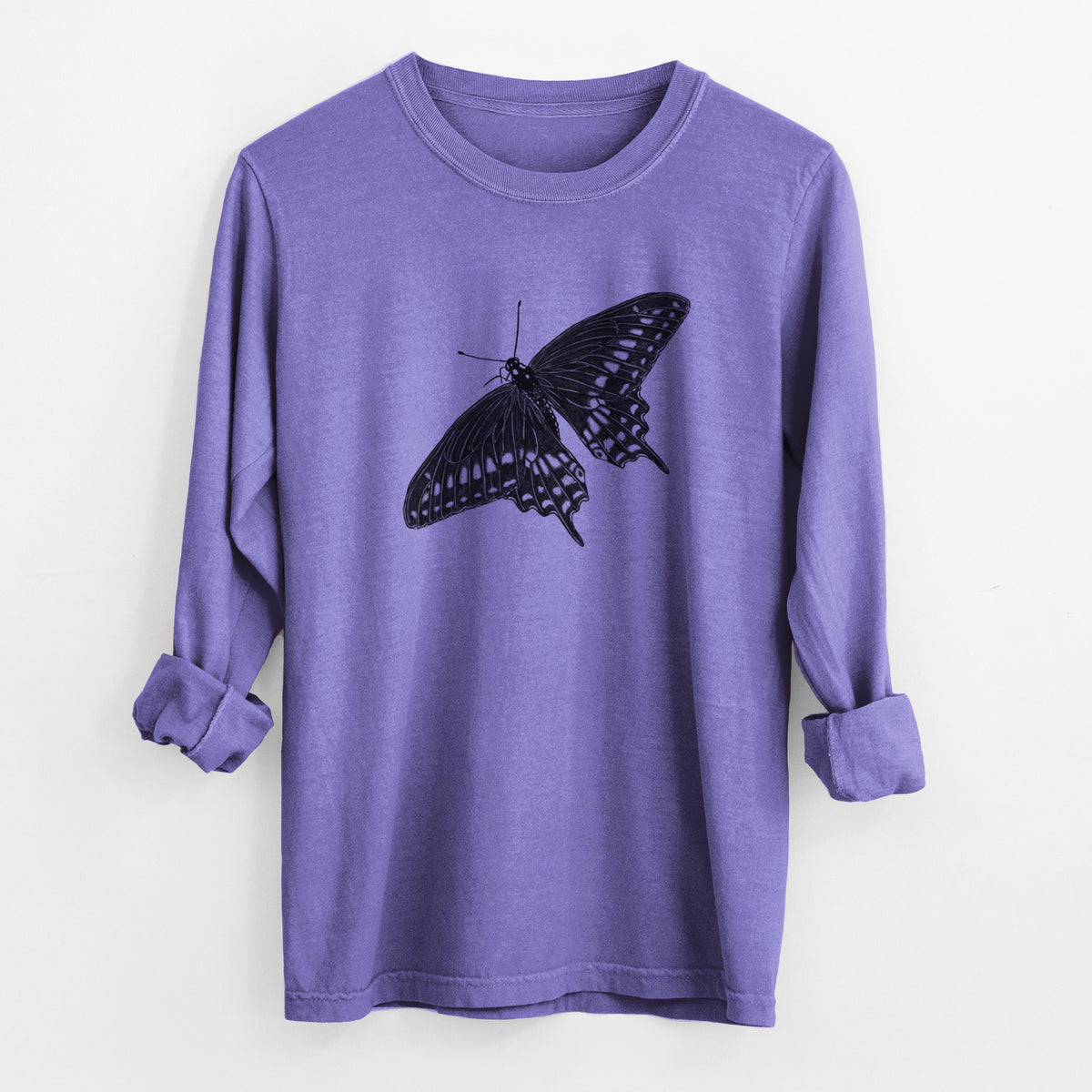 Violet purple Comfort Colors long sleeve shirt laid flat with the cuffs rolled, printed with a detailed black ink illustration of a black swallowtail butterfly with its wings spread.