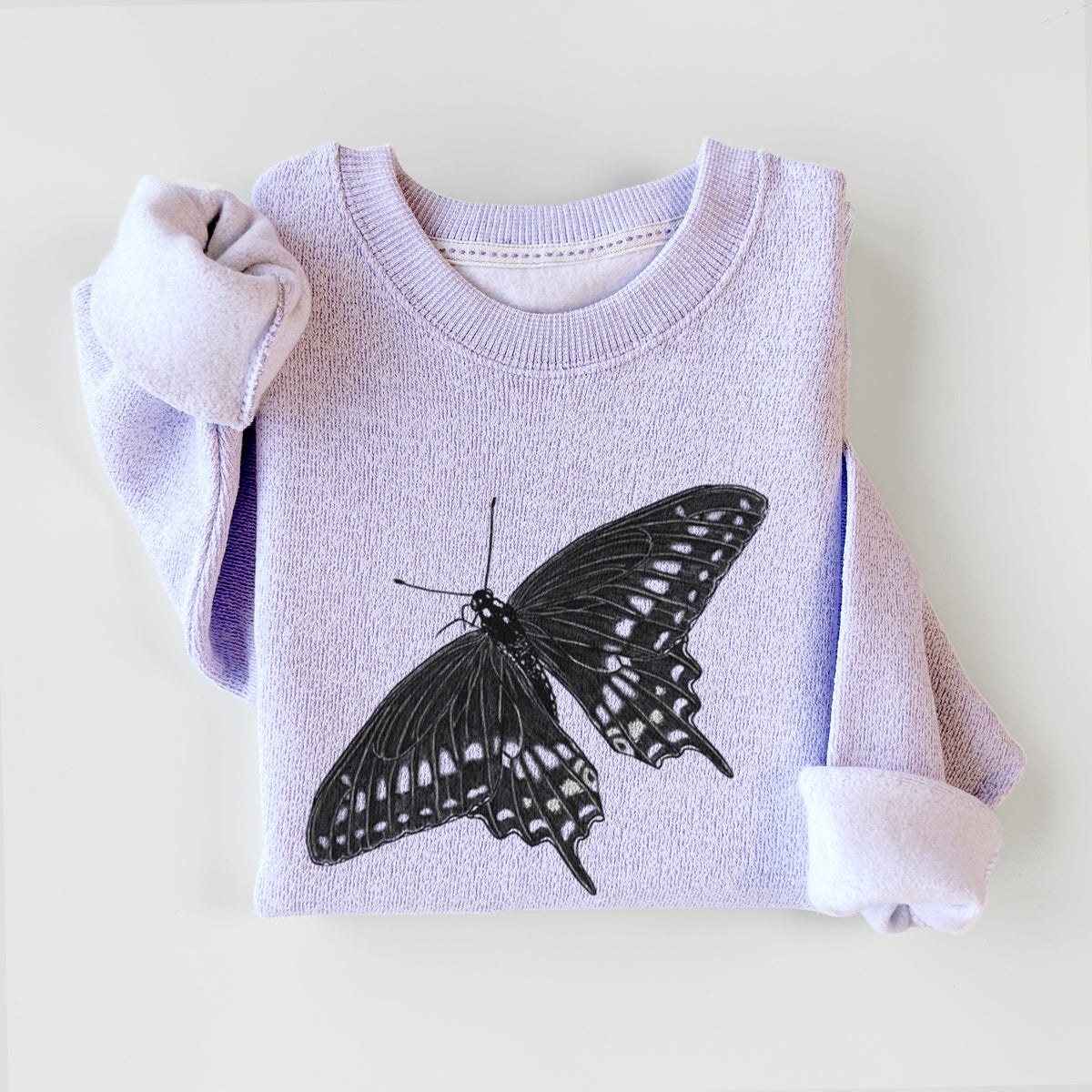 Ice purple knit sweatshirt printed with a detailed black ink illustration of a black swallowtail butterfly with its wings spread, styled flat.