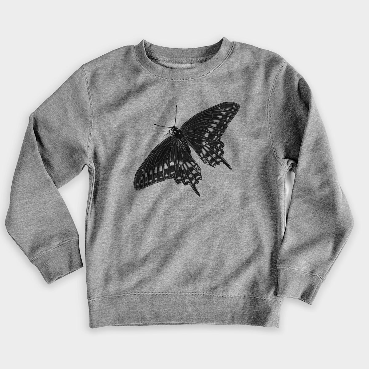Nickel grey youth crewneck sweatshirt laid flat, printed with a detailed black ink illustration of a black swallowtail butterfly with its wings spread.