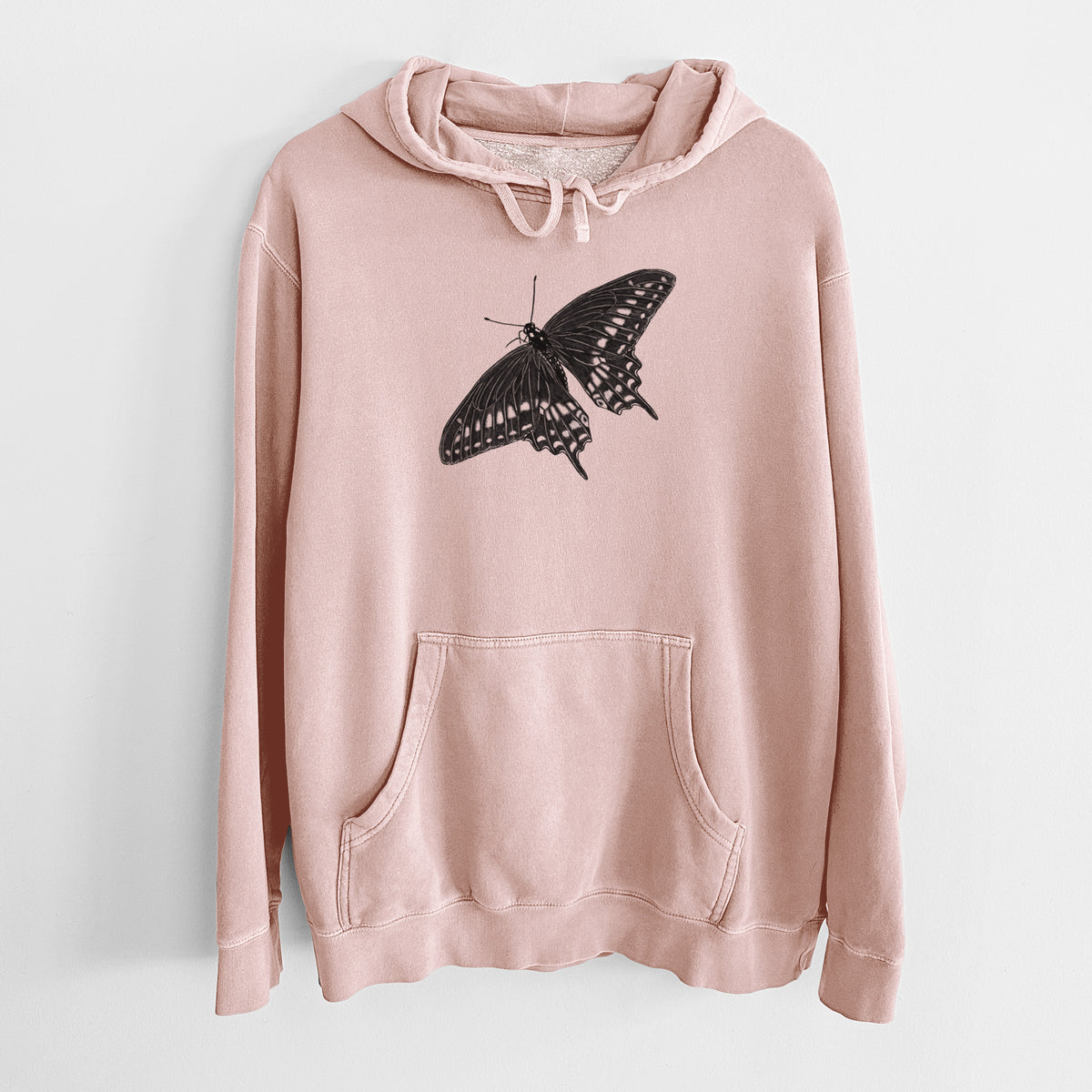 Dusty pink pigment dyed hoodie laid flat, printed with a detailed black ink illustration of a black swallowtail butterfly with its wings spread.