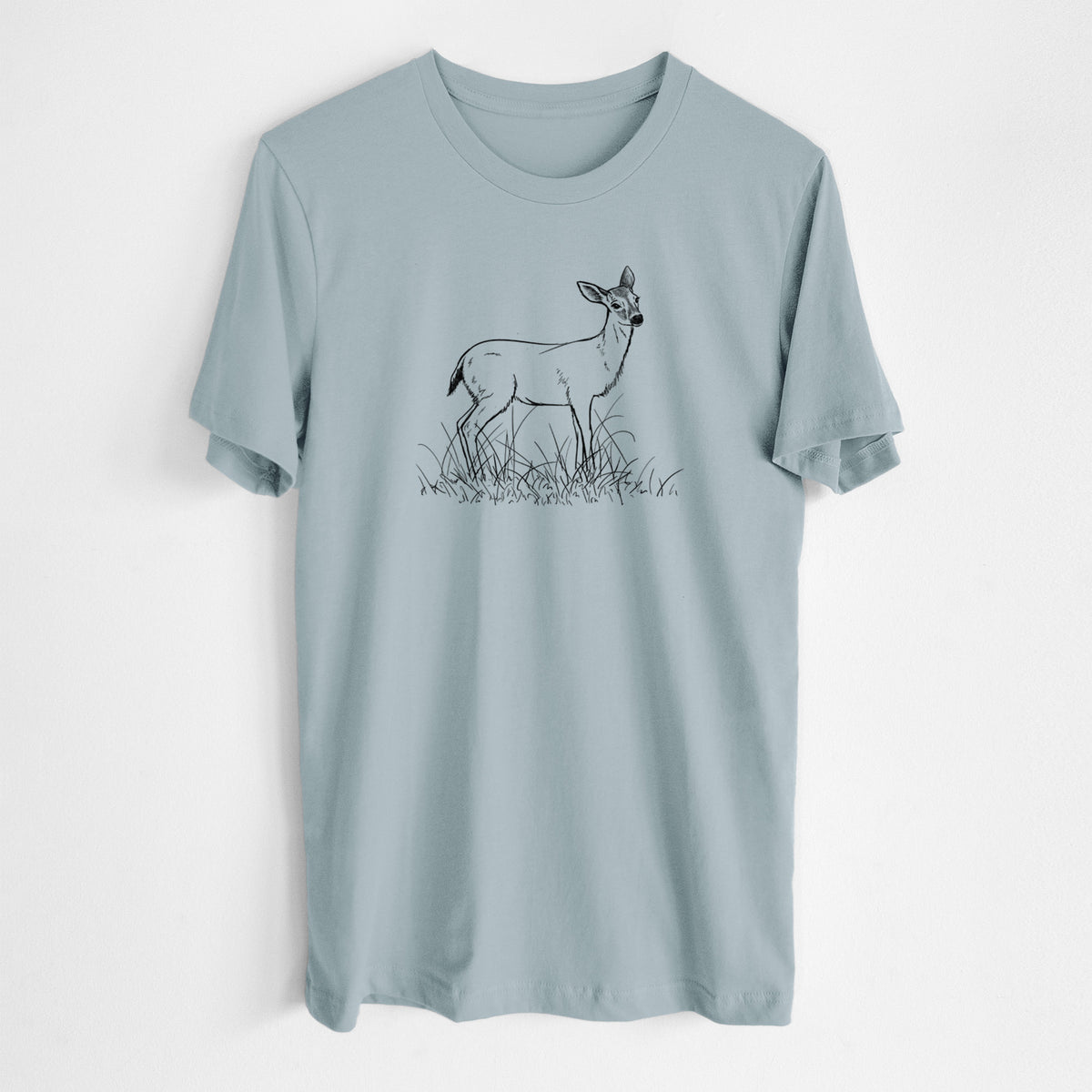 Vintage denim lightweight cotton t-shirt laid flat, printed with a black ink sketch of a black-tailed deer standing in tall grass.