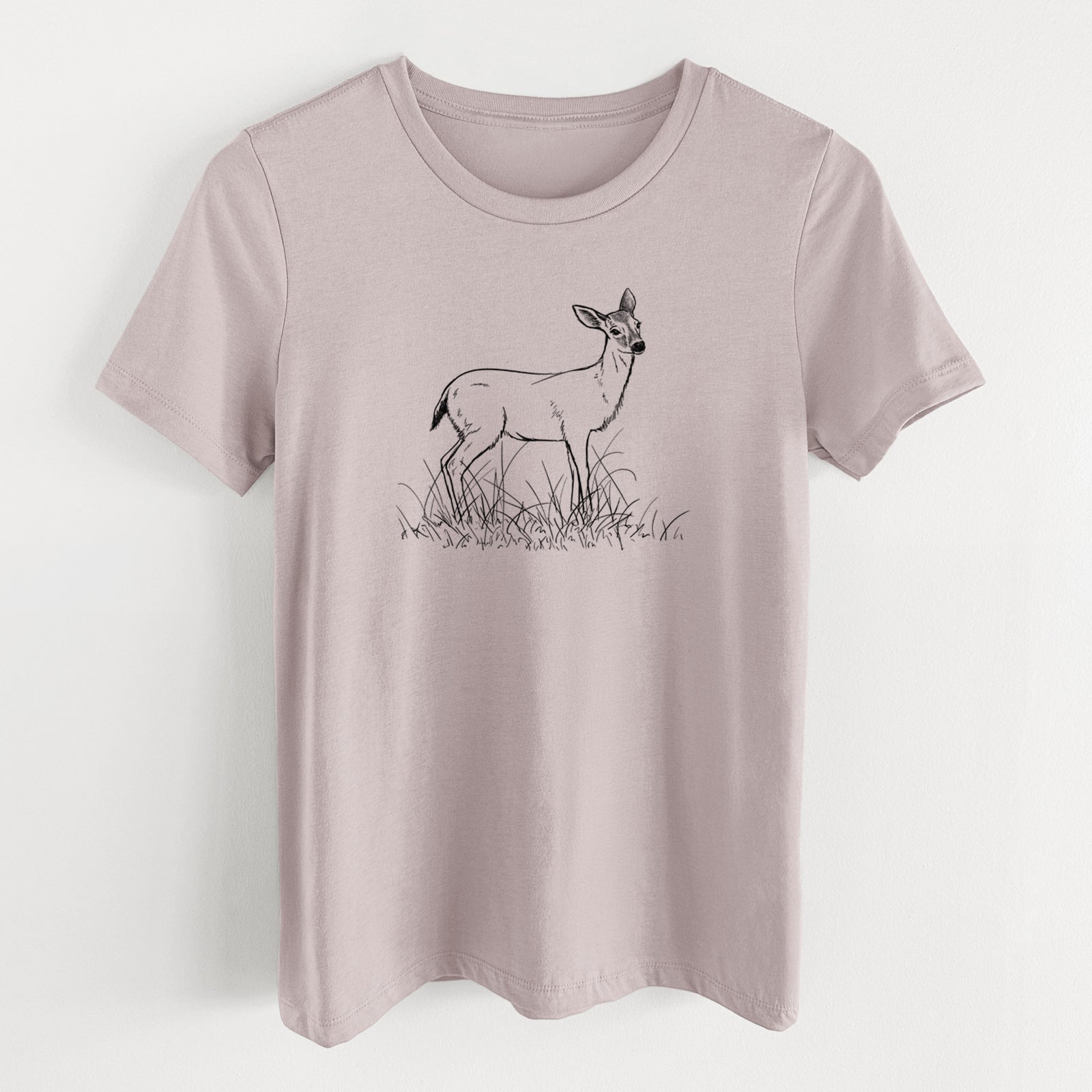 Pink gravel women's relaxed fit cotton t-shirt laid flat, printed with a black ink sketch of a black-tailed deer standing in tall grass.