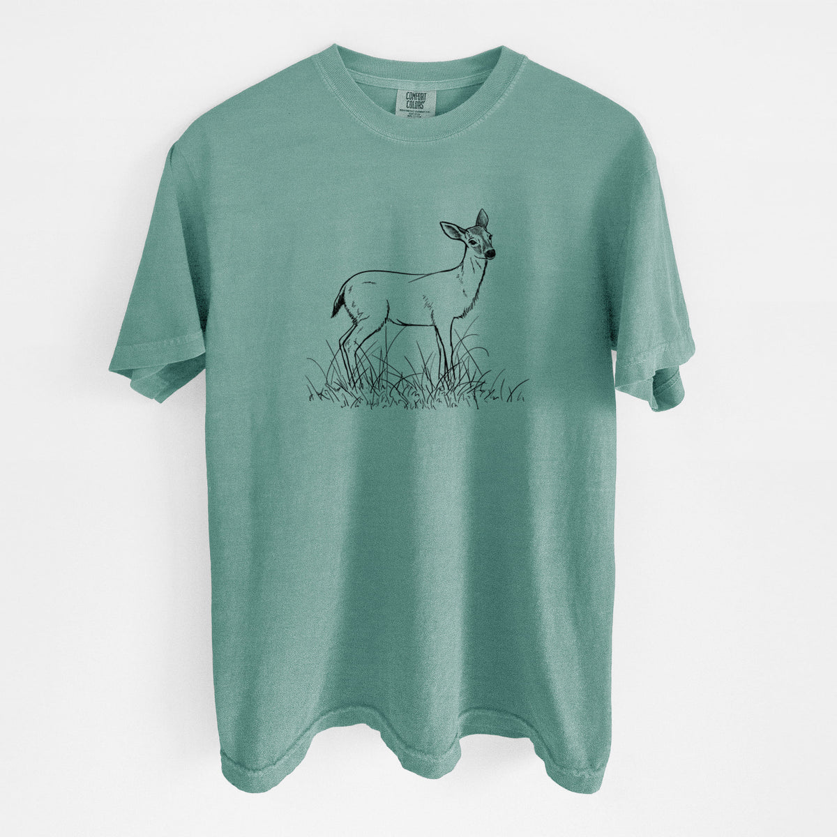 Reef green Comfort Colors t-shirt laid flat, printed with a black ink sketch of a black-tailed deer standing in tall grass.