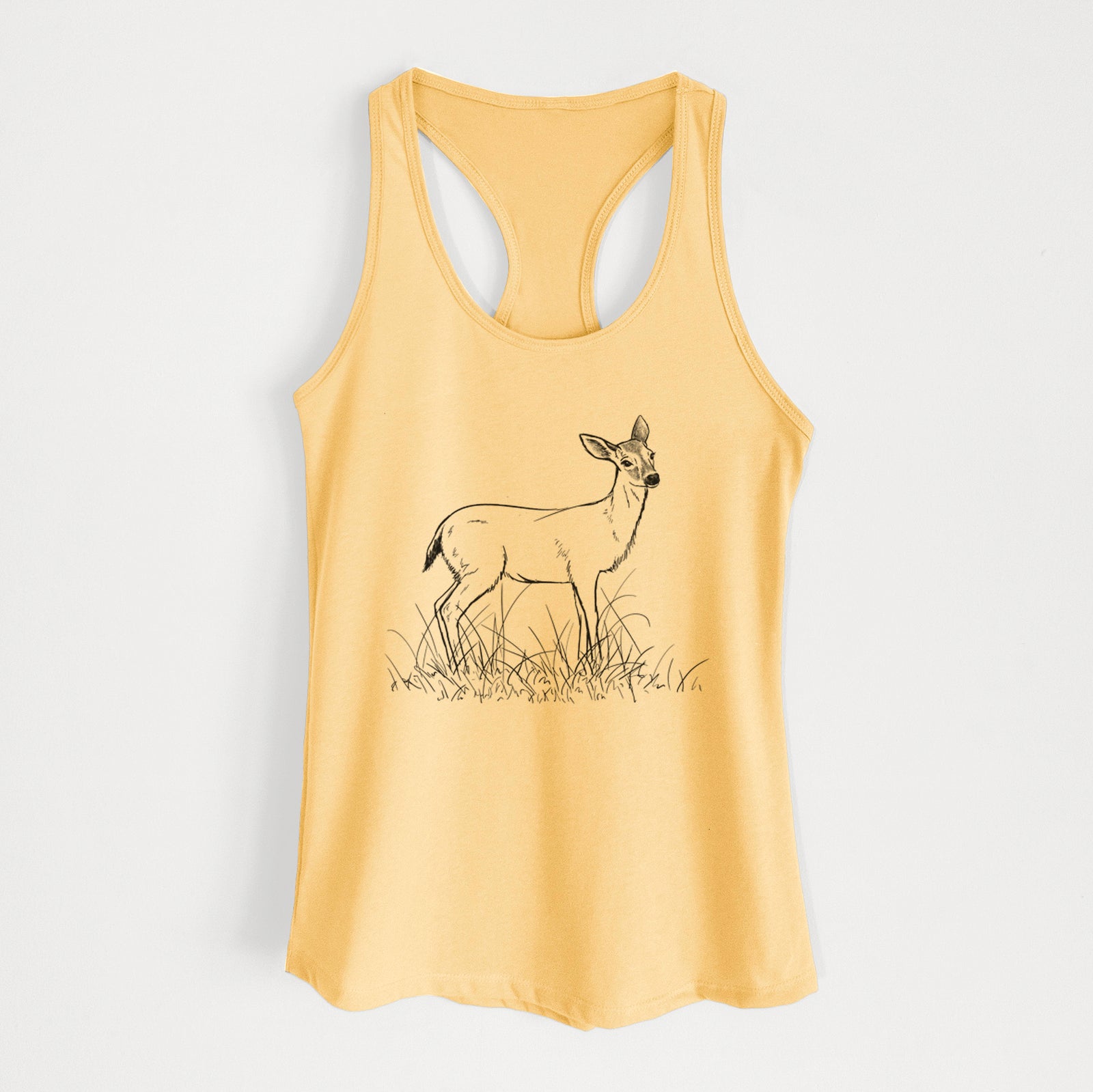 Banana cream women's racerback tank top laid flat, printed with a black ink sketch of a black-tailed deer standing in tall grass.