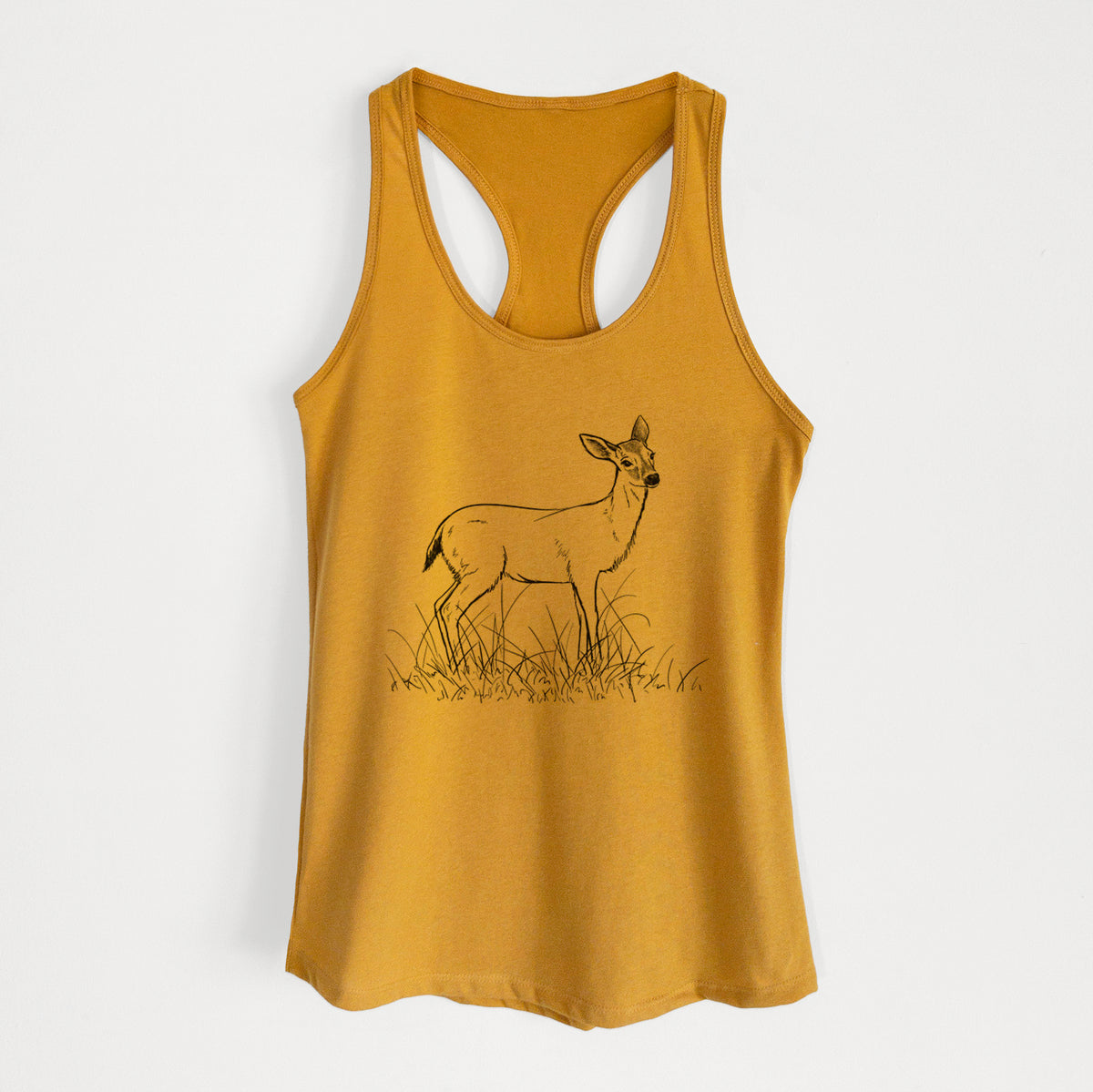 Gold women's racerback tank top laid flat, printed with a black ink sketch of a black-tailed deer standing in tall grass.