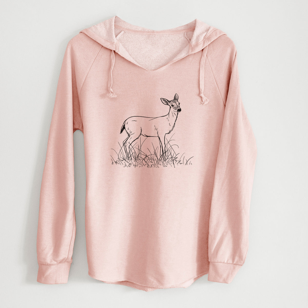 Blush pink women's Cali Wave hooded sweatshirt laid flat, printed with a black ink sketch of a black-tailed deer standing in tall grass.
