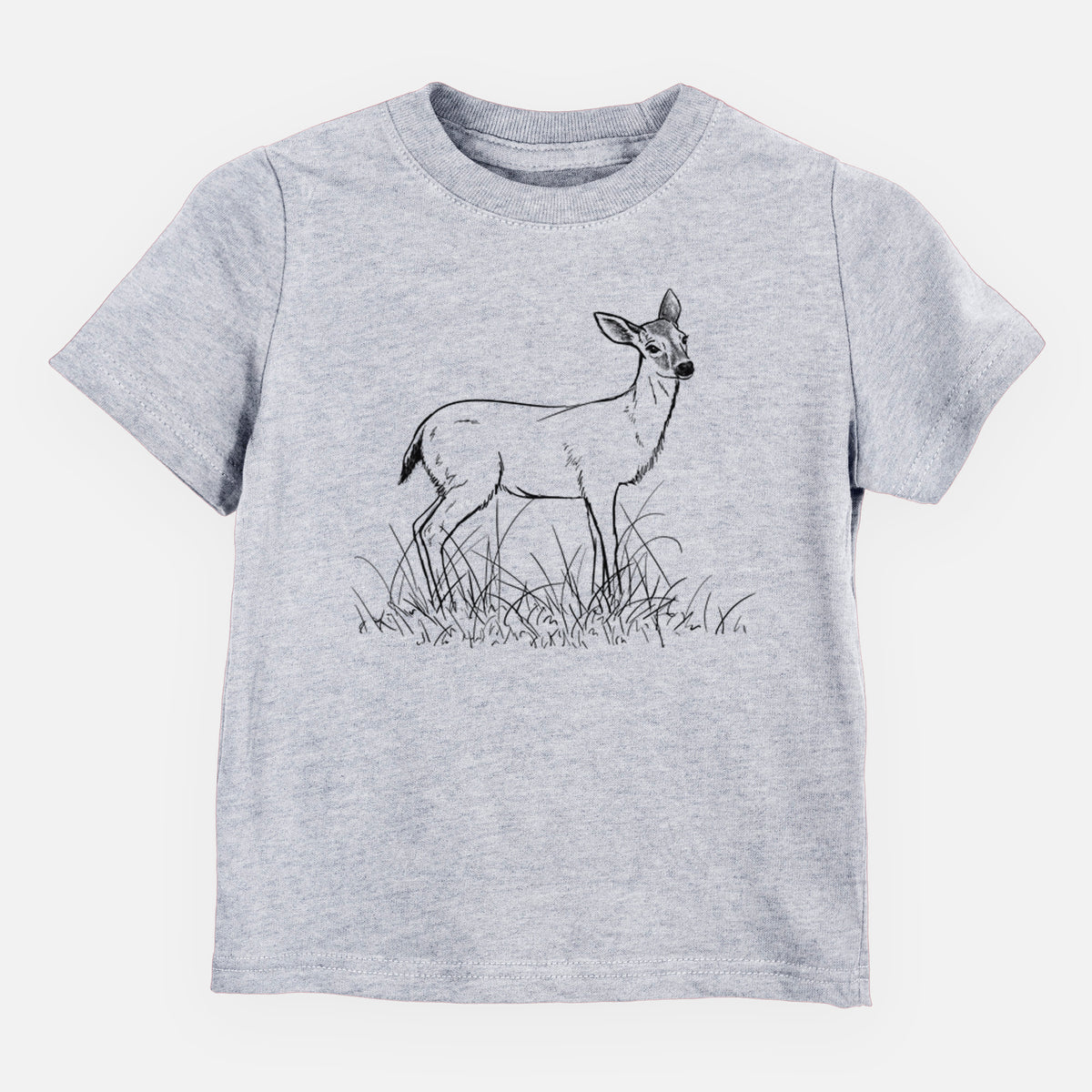 Heather grey toddler t-shirt laid flat, printed with a black ink sketch of a black-tailed deer standing in tall grass.